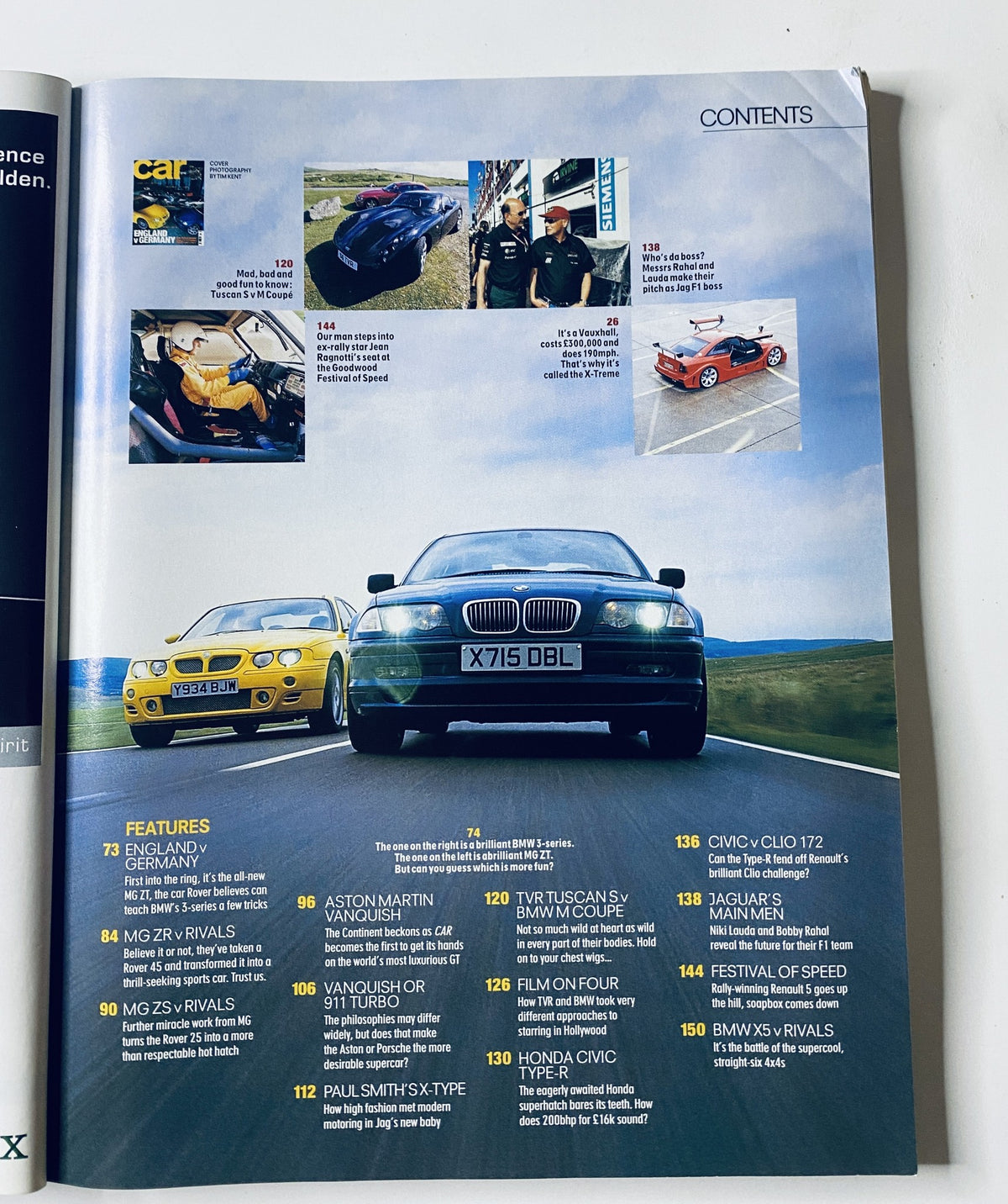 Image showing the contents page of CAR Magazine September 2001 featuring car models including Aston Martin Vanquish, TVR Tuscan S, BMW M Coupe, and more. Contains highlights on features like England v Germany and car comparisons.