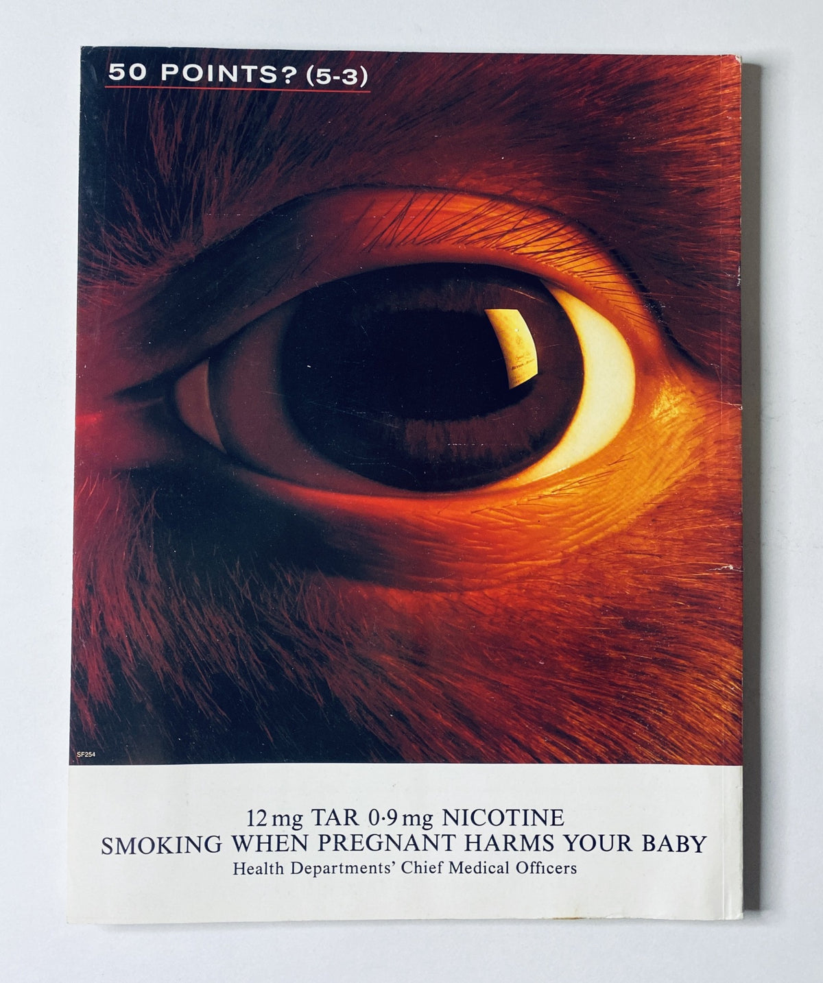 Cover of a health pamphlet titled "50 Points? (5-3)" with an eye graphic, mentioning warning about smoking during pregnancy, related to health concerns.