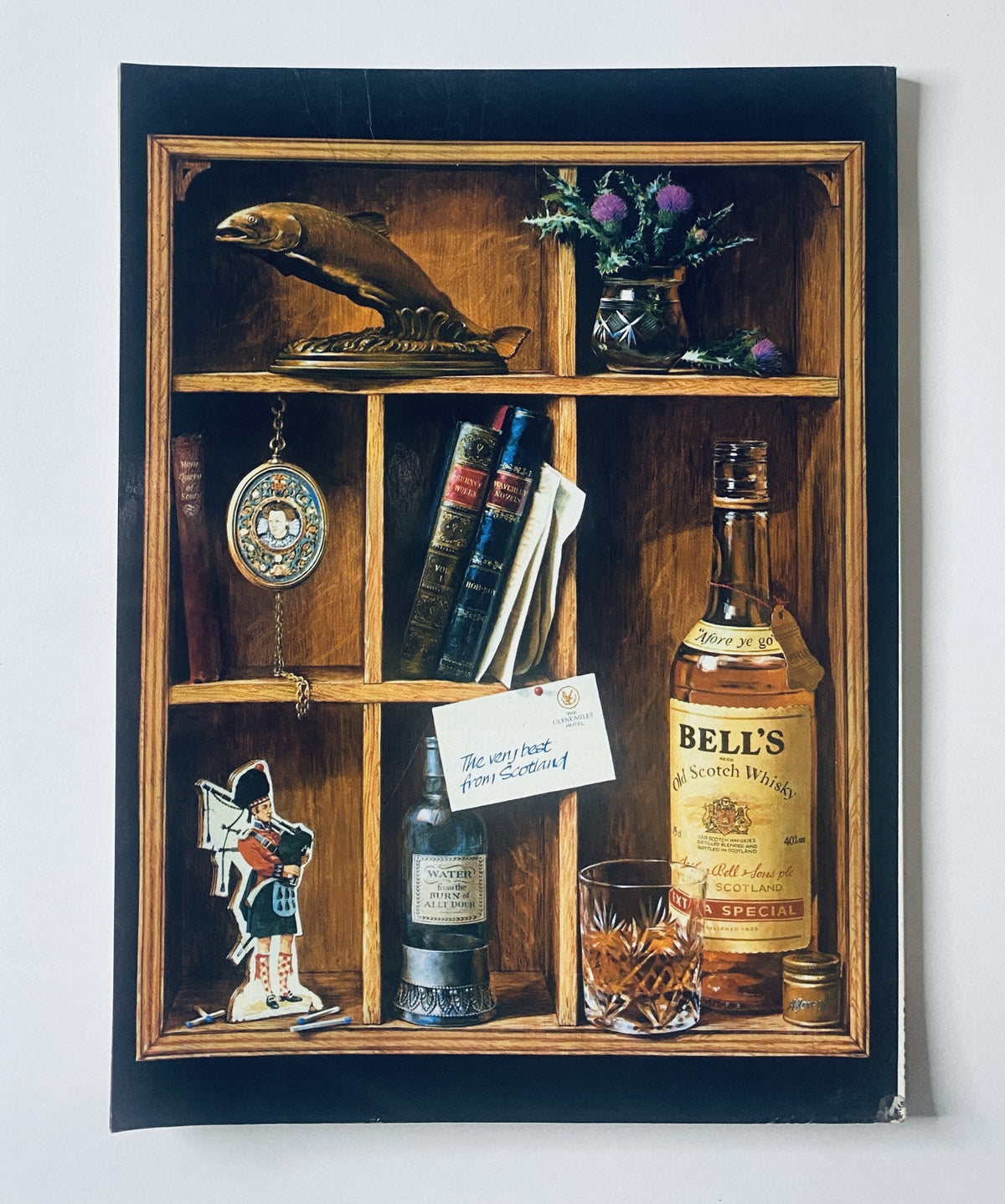 Artistic representation featuring shelves displaying various items including a bottle of Bell's Scotch whiskey, symbolizing a vintage aesthetic. This is not directly related to Car Magazine July 1989.