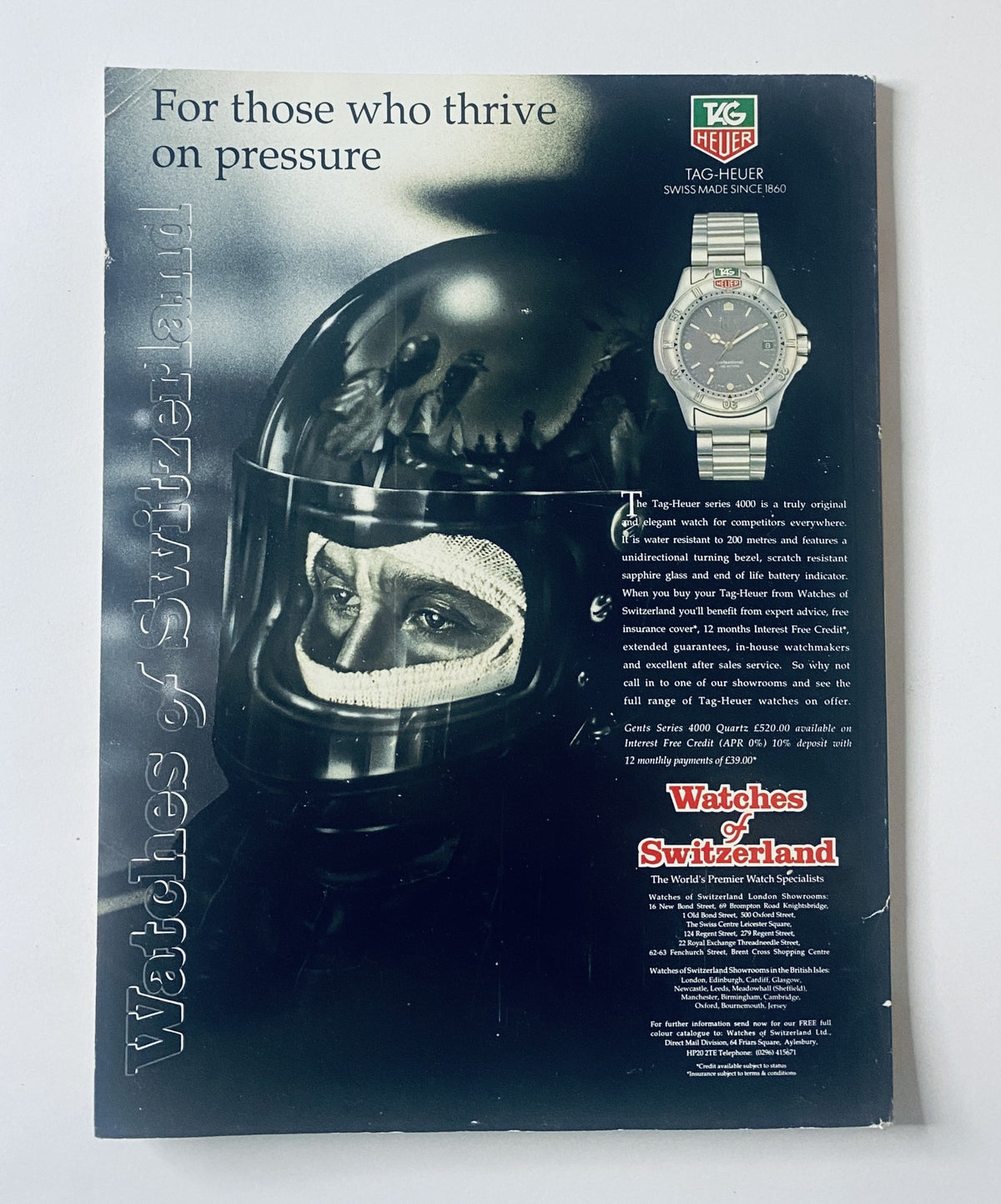 Advertisement for TAG Heuer featuring a racing helmet and watch, found in Car Magazine April 1992.