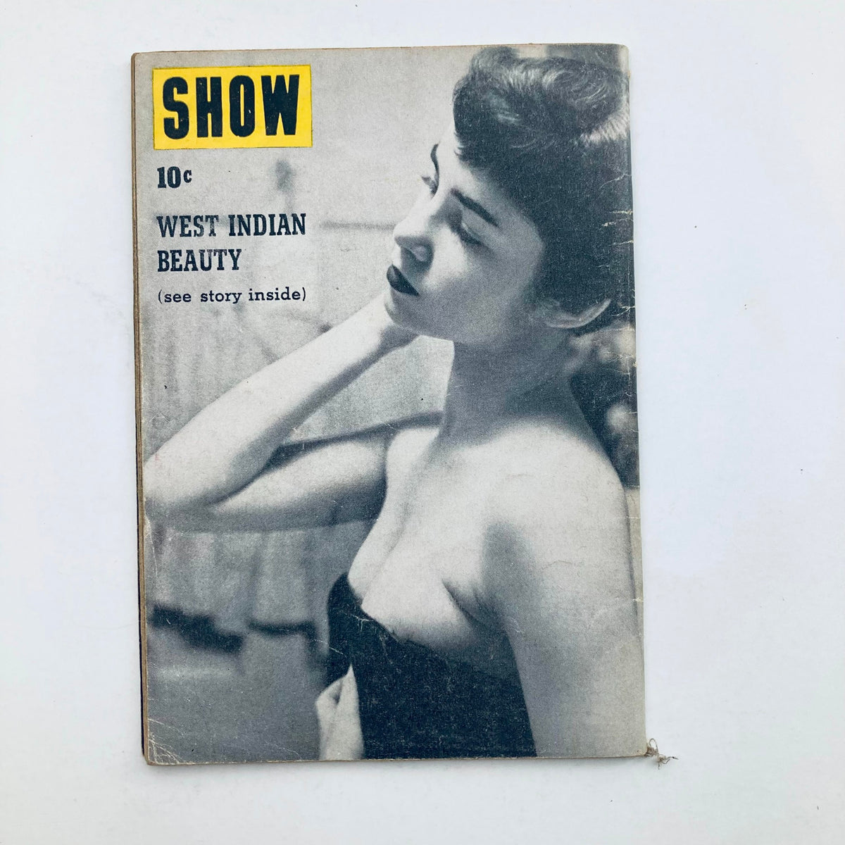 Cover of a vintage Show Magazine with the title 'West Indian Beauty', dated 1954, featuring a monochrome image of a young woman, emphasizing the historic and artistic value of mid-20th century magazine covers.