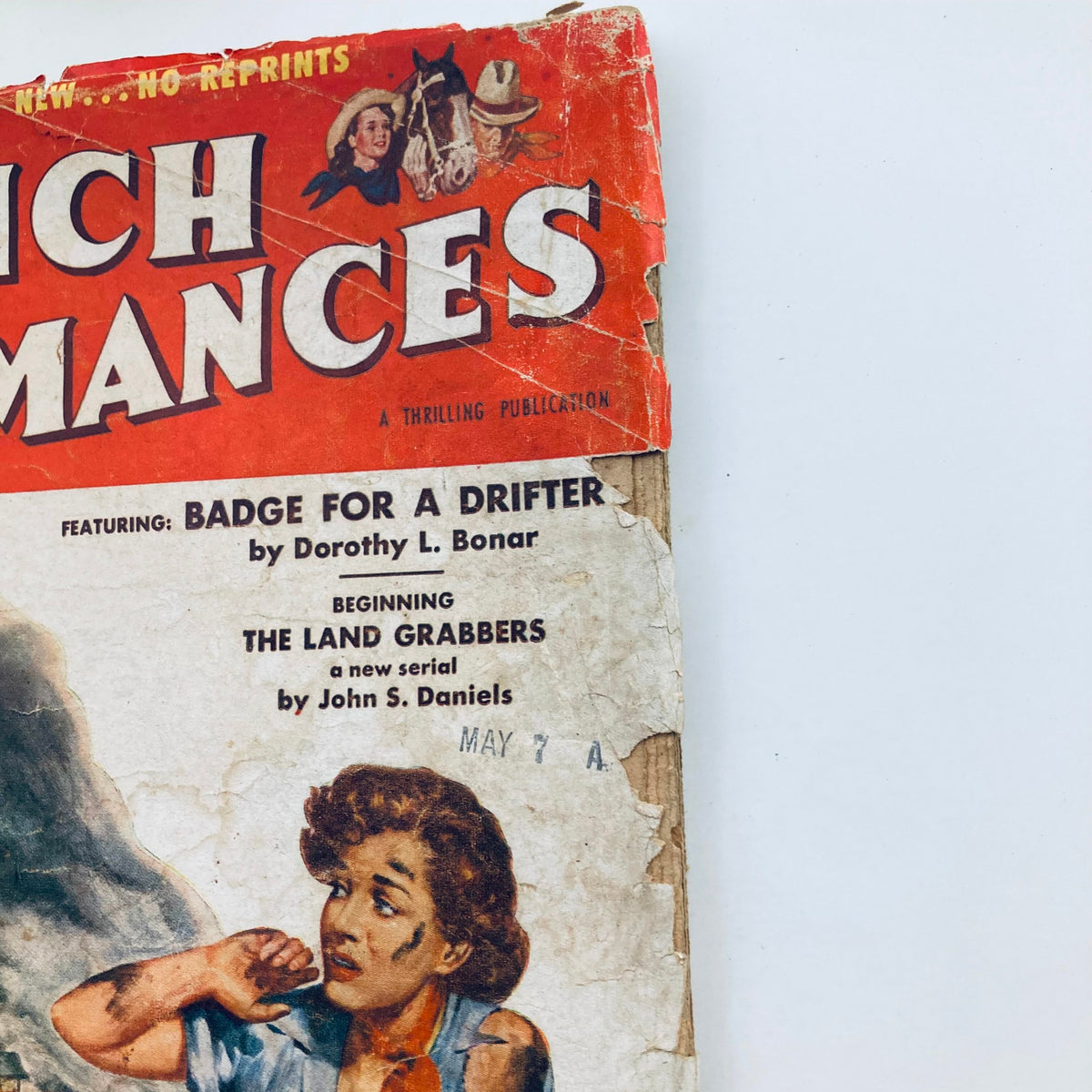 Close-up of the Ranch Romances Magazine cover from June 4, 1954, highlighting the title 'The Land Grabbers' and the illustration of a startled woman, emphasizing its vintage appeal.