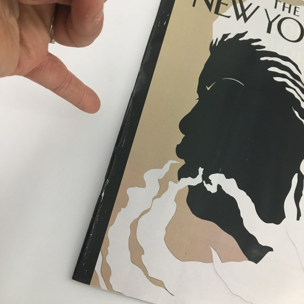 Close-up view of The New Yorker August 19 2019 Full Magazine Cover showing a hand pointing towards the edge of the magazine, highlighting its vintage nature and condition.