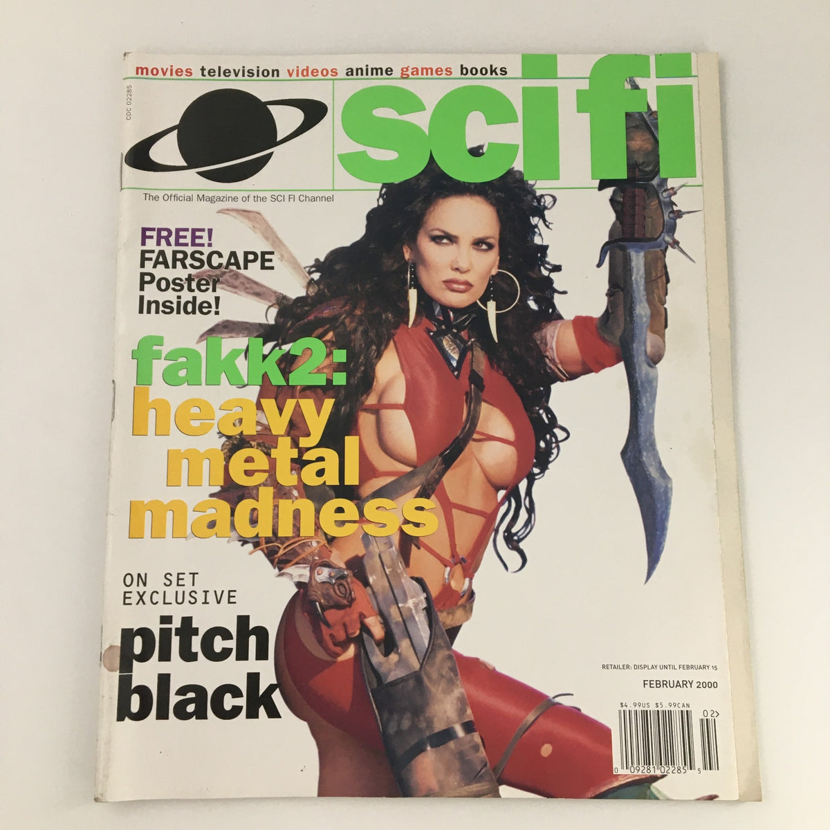 Cover of Sci-Fi Channel Original Magazine February 2000 titled 'Heavy Metal Madness' featuring a strong female character with a futuristic weapon, promoting the movie 'Pitch Black.'
