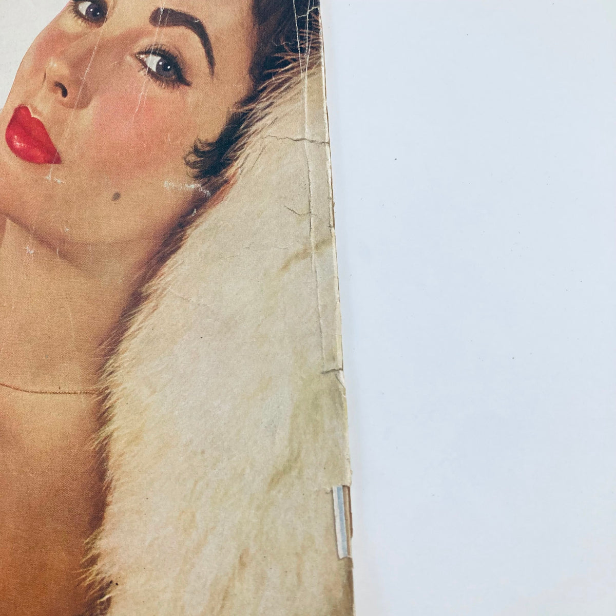 Close-up image of the cover of VTG Movieland Magazine November 1955 featuring Elizabeth Taylor, showcasing her glamorous look with red lips and fur collar.
