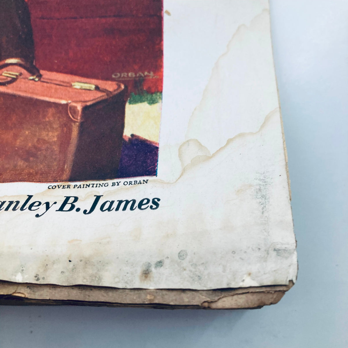 Close-up of the lower corner of the cover of VTG Columbia Magazine September 1937, highlighting the cover painting by Stanley B. James and showing the magazine's wear.
