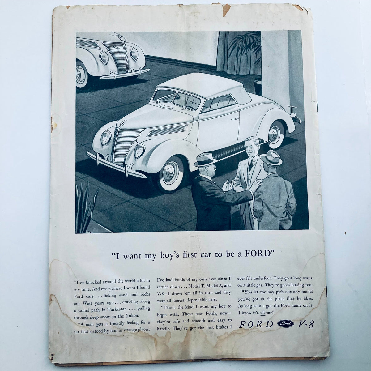 Back cover of VTG Columbia Magazine September 1937, featuring an advertisement related to Ford cars with a vintage illustration showcasing cars and men discussing options.
