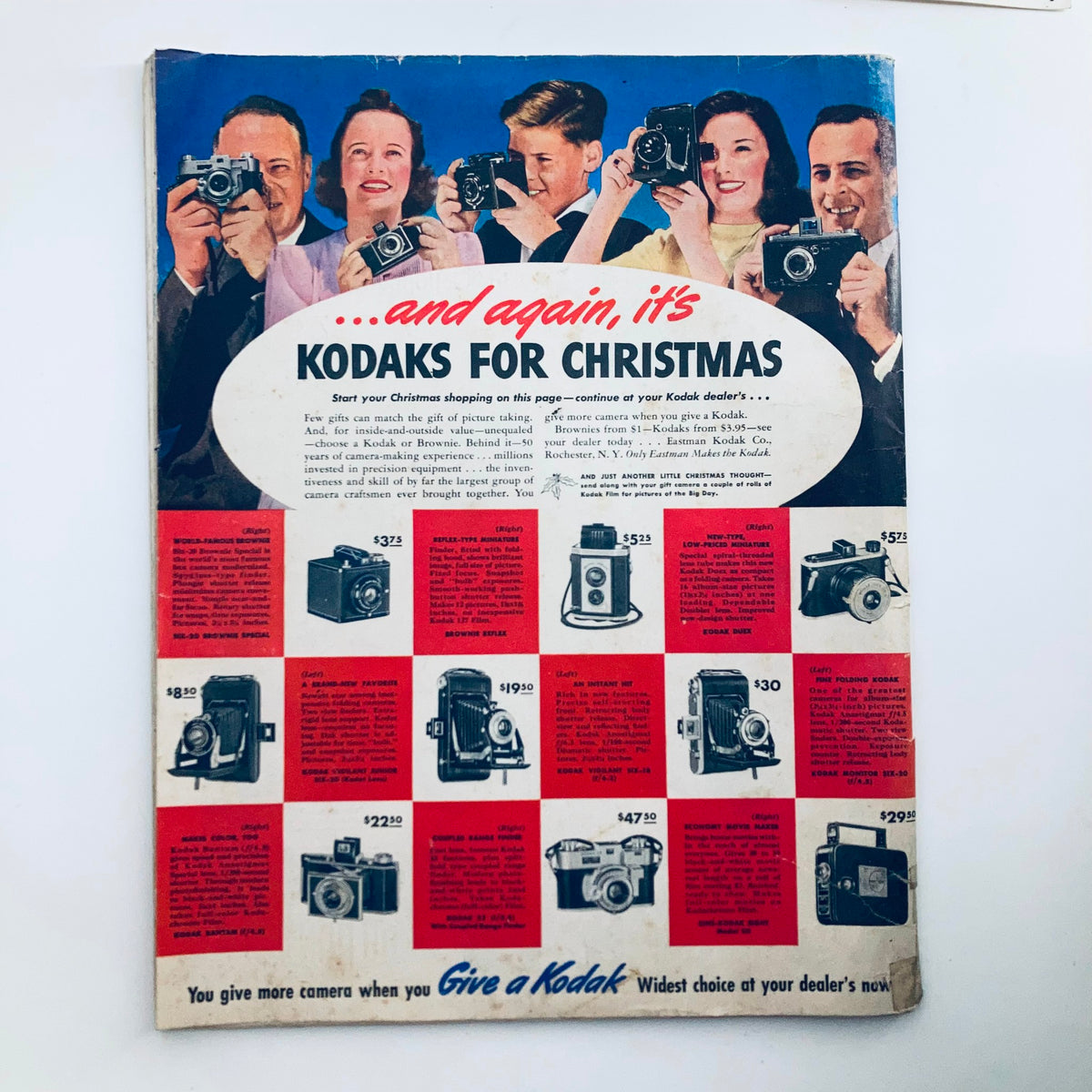 Back cover of The Saturday Evening Post Magazine December 7, 1940 promoting Kodak cameras for Christmas with images of various models.
