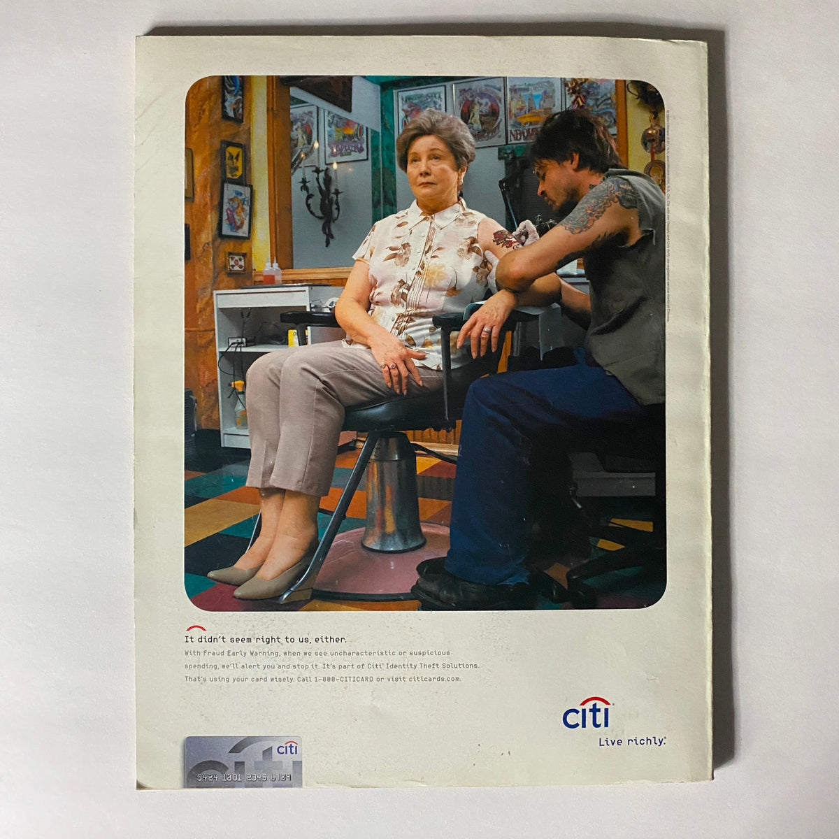 Back cover of W Magazine July 2004, featuring an advertisement by Citi, promoting financial services with a relatable imagery reflecting everyday life.
