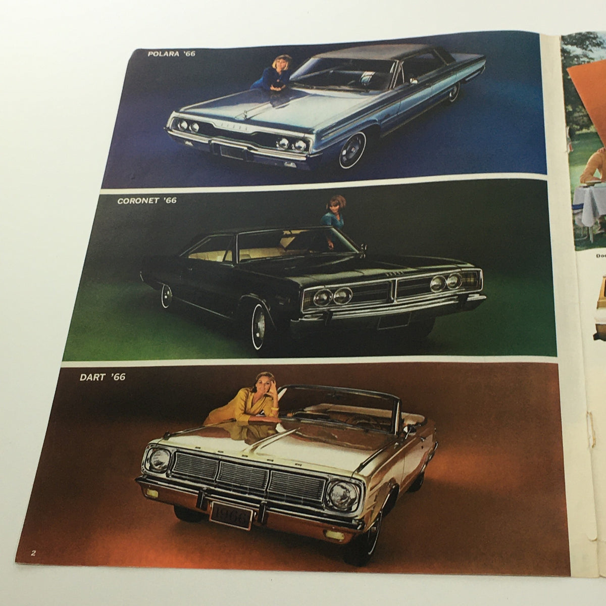 An illustration from the 1966 Dodge Monaco Polara Coronet Dart brochure displaying the Polara, Coronet, and Dart models in attractive colors.