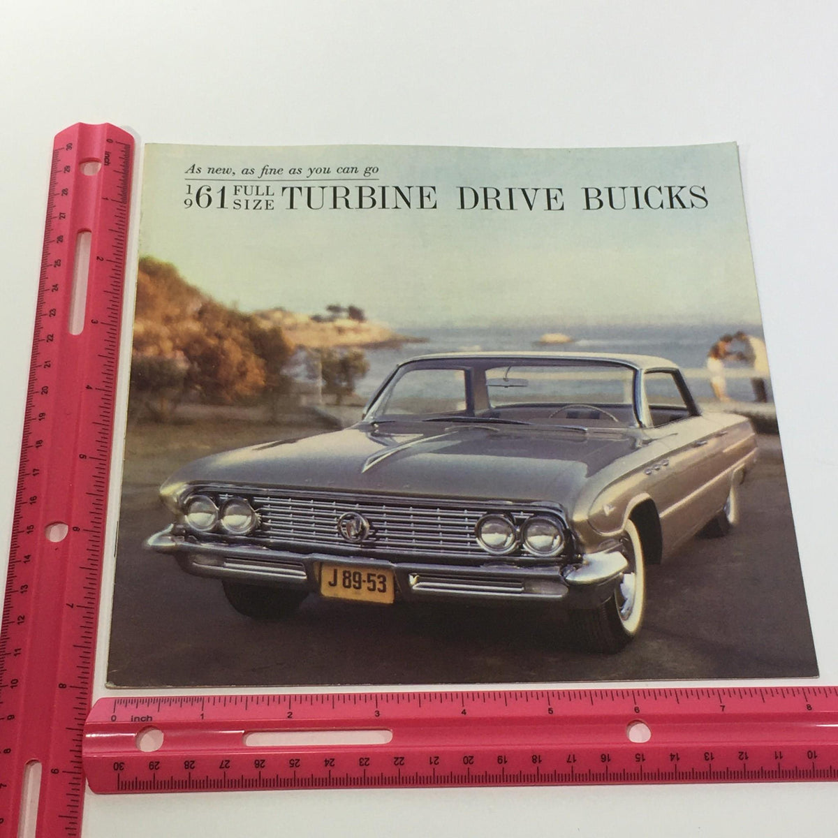 1961 Full Size Turbine Drive Buicks 4-Door and 2-Door Sedan Car Sale Brochure with a stunning image of a full-size Buick in a coastal setting, highlighting the classic styling of the era.