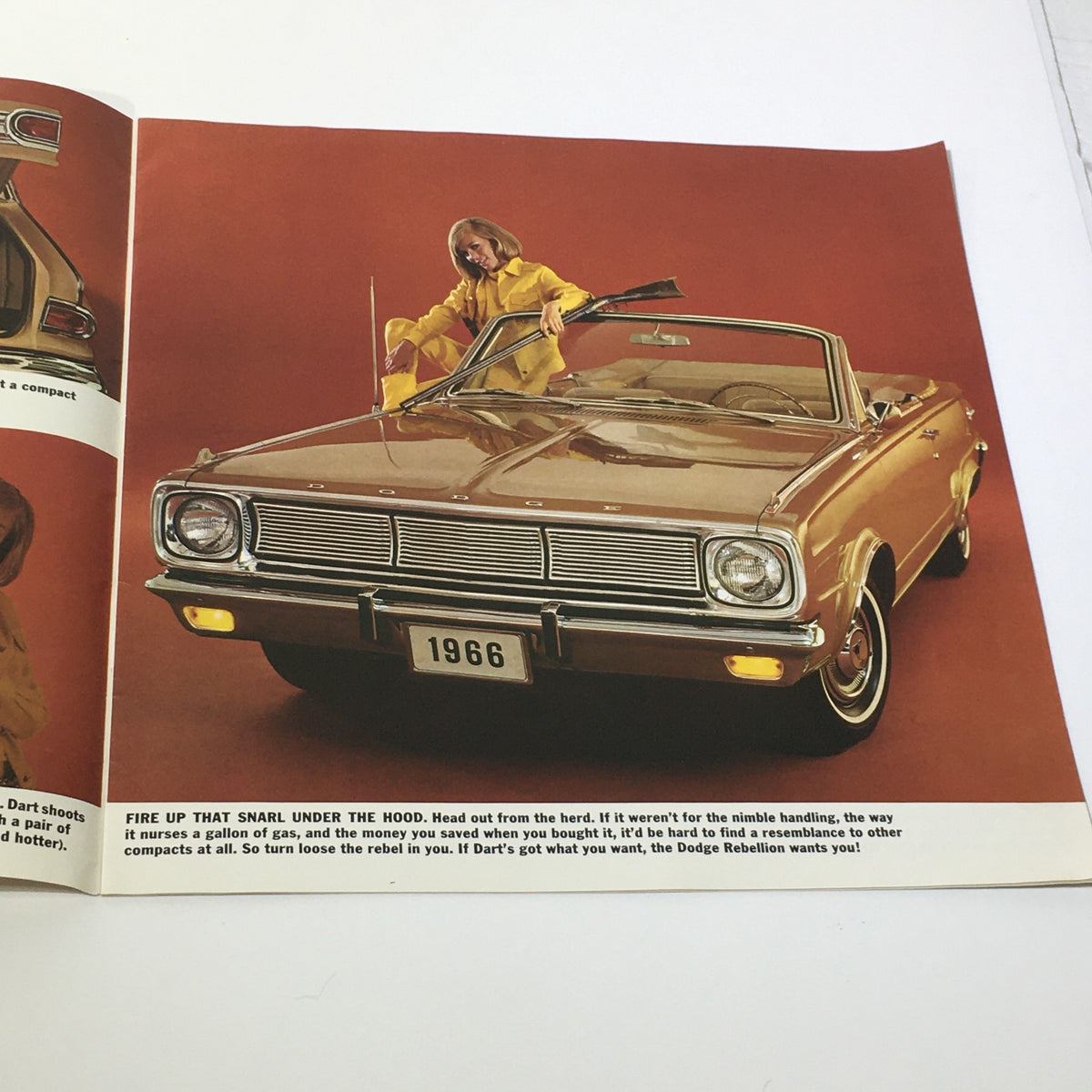 1966 Dodge Dart V-8 Engine 4-Speed Gearbox 2-Door Sedan Car Sale Brochure showing a woman leaning on the hood of a convertible Dodge Dart, emphasizing its stylish design and engine power.