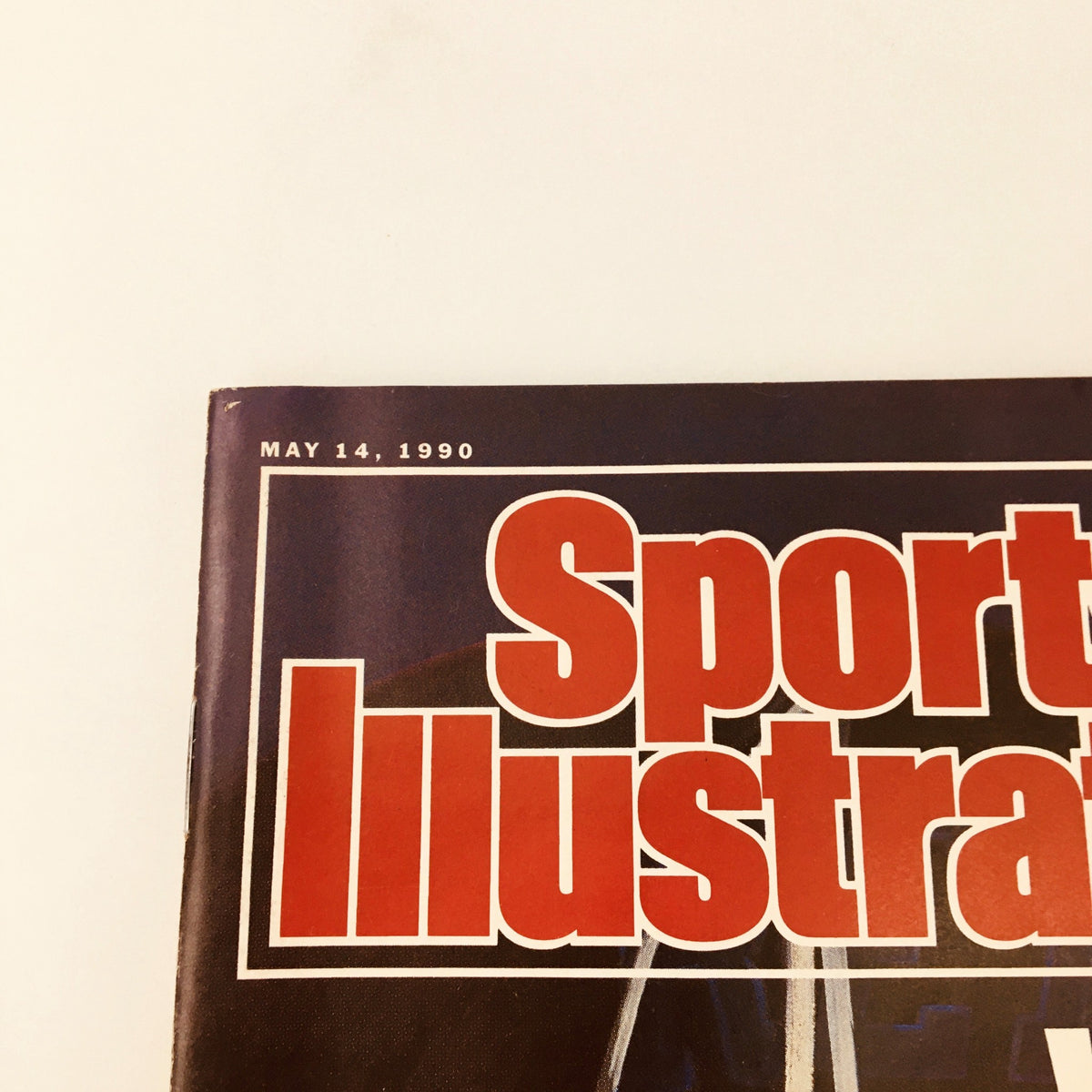Close-up of the header of Sports Illustrated Magazine dated May 14, 1990, showcasing the magazine title prominently.