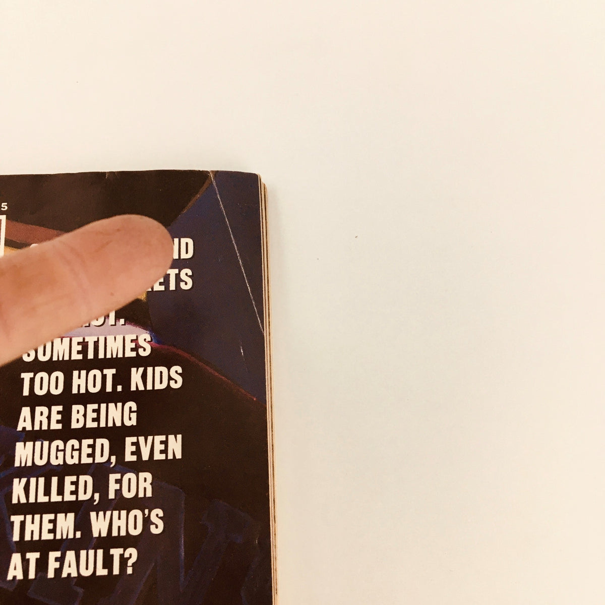 Detail of the left side of Sports Illustrated Magazine from May 14, 1990, featuring a gripping tagline about the dangers associated with sneakers and team jackets.