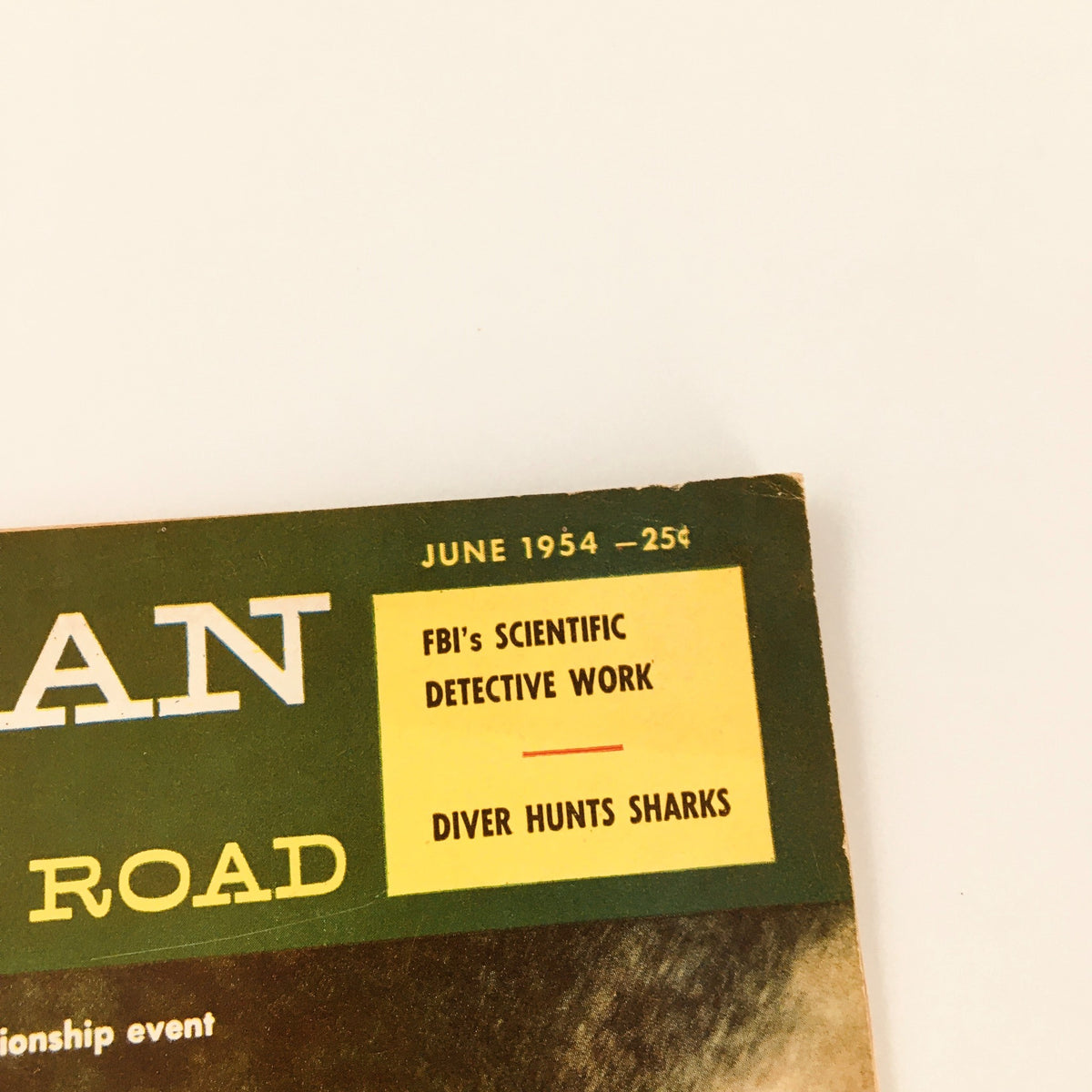 Detail of the June 1954 American Boy & Open Road Magazine cover, highlighting the magazine's features including 'FBI's Scientific Detective Work' and 'Diver Hunts Sharks'.