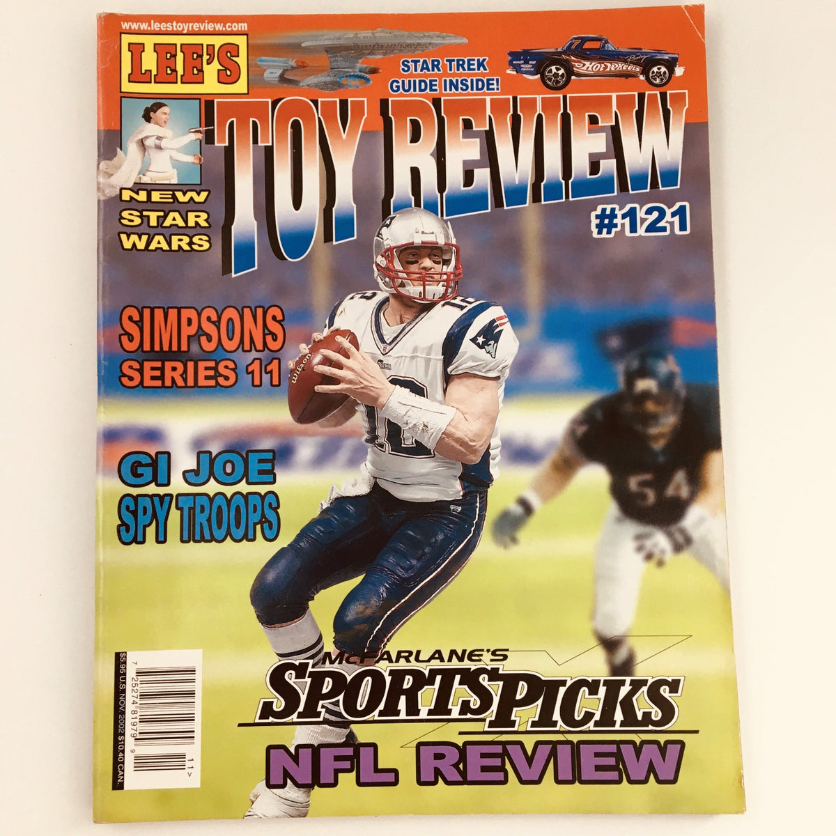 Lee's Toy Review Magazine #121 November 2002 featuring Sports Picks NFL Review on the cover, showcasing a quarterback in action, highlighting collectible sports memorabilia from the early 2000s.