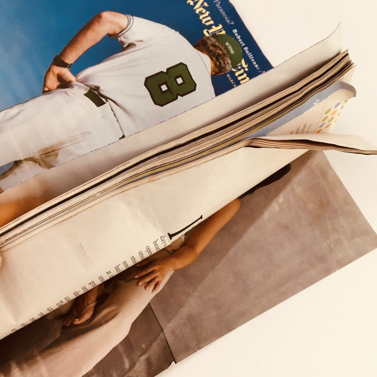 Side view of The New York Times Magazine March 28 2004 showing multiple pages and the visible wear from age.
