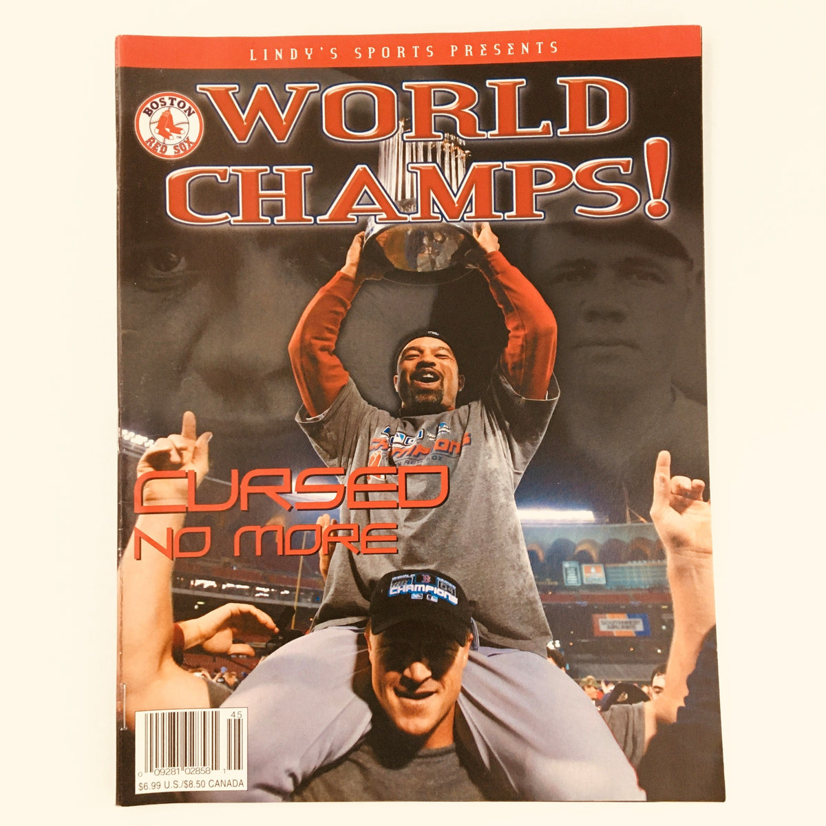 Cover of Lindy Sport's Presents 2004 World Series Champs Boston Red Sox magazine, featuring celebratory players and the caption 'World Champs! Cursed No More'.