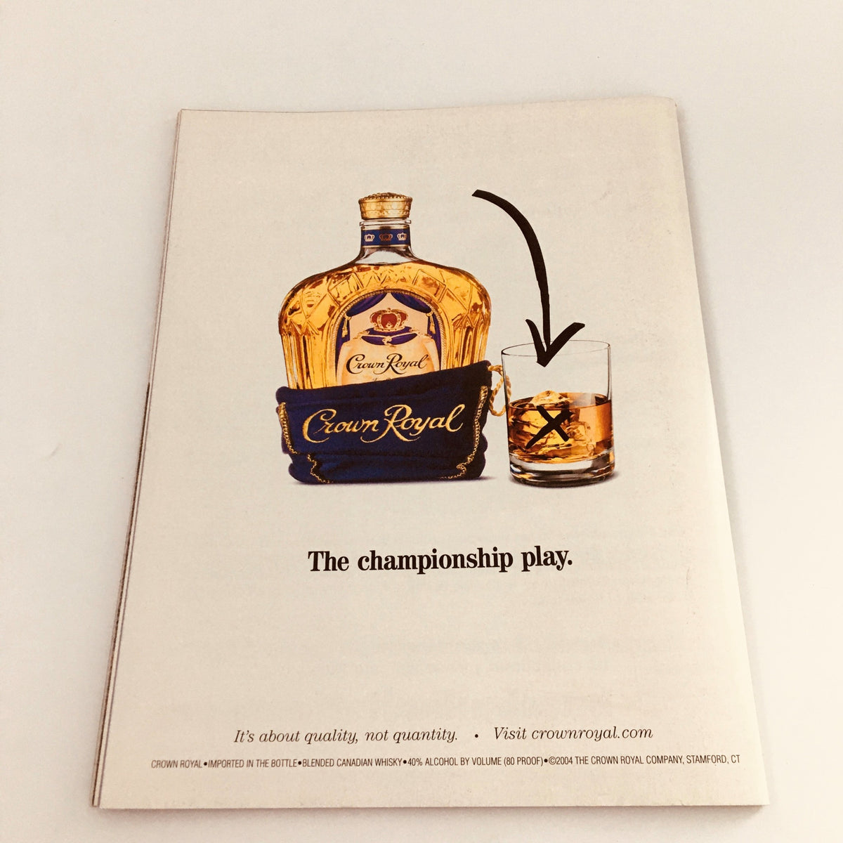 Advertisement for Crown Royal featured in Lindy Sport's Presents 2004 World Series Champs Boston Red Sox, promoting premium whiskey with a focus on quality.