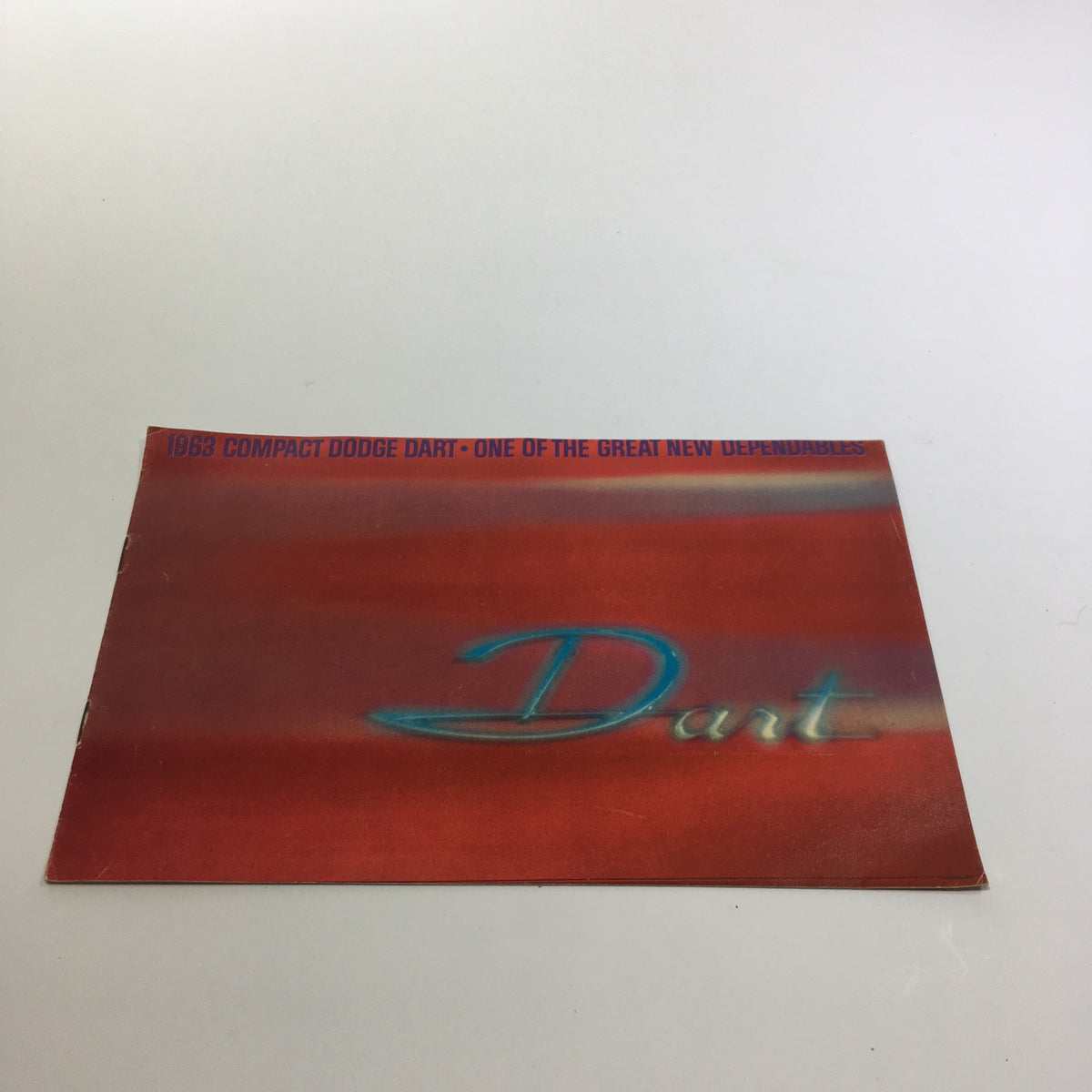 1983 Compact Dodge Dart 270 Series 2-Door Convertible Sedan Car Catalog Brochure, featuring a vibrant red cover with the word 'Dart' highlighted.