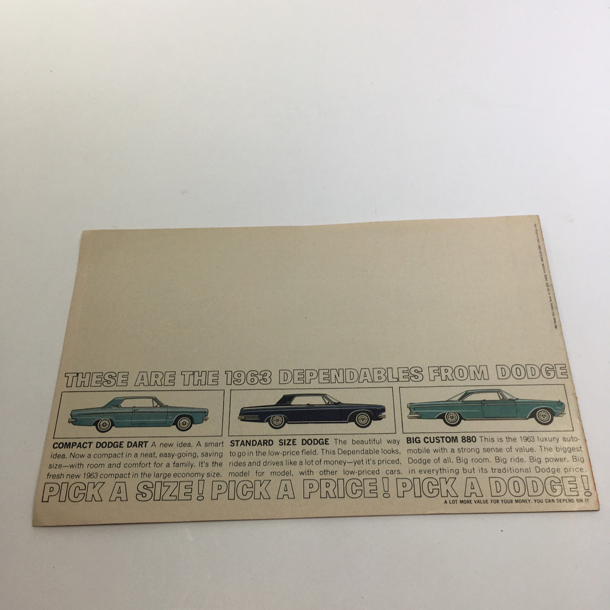 Back cover of the 1983 Compact Dodge Dart 270 Series brochure, displaying information about different Dodge models with a focus on the Dart.