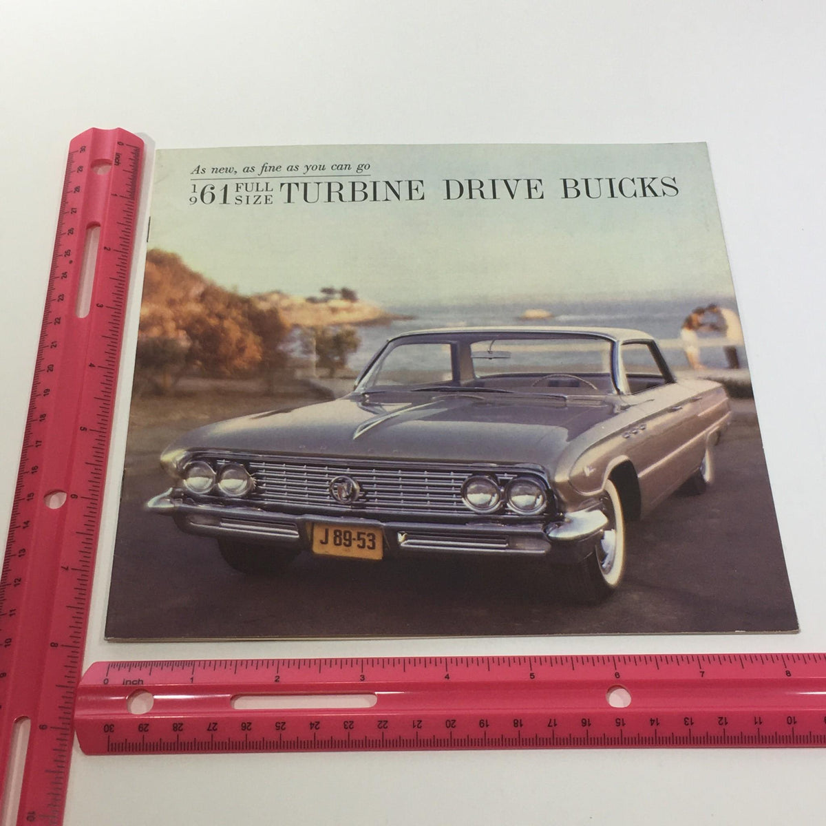 1961 Turbine Drive Buicks Electra 225 catalog cover featuring a vintage car, showcasing the luxurious design and engineering craftsmanship.