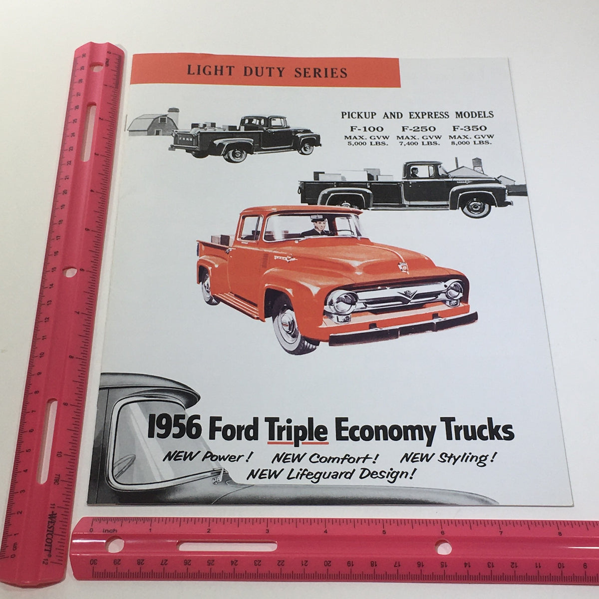 1956 Ford Triple Economy Trucks Light Duty Series F-100 250 350 Catalog Brochure cover displaying an illustration of the truck models with emphasis on new power, comfort, and styling.