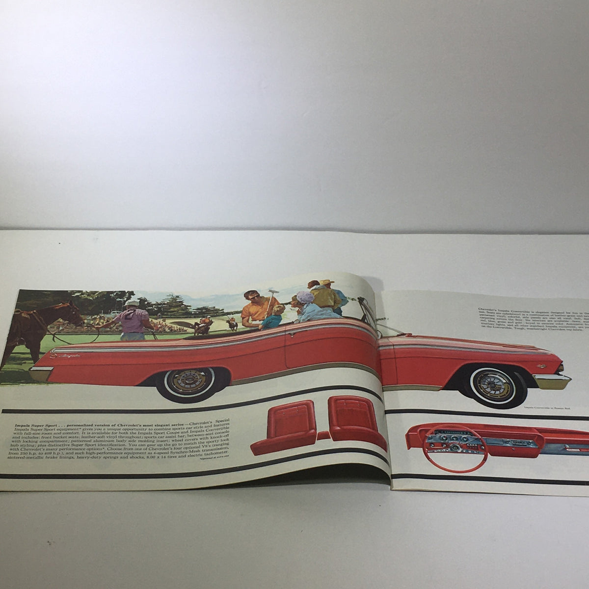 Interior view of the 1962 Chevrolet Impala Super Sport showing a red convertible with people enjoying a day out. Catalog for Turbo-Fire 283 V-8 Engine.