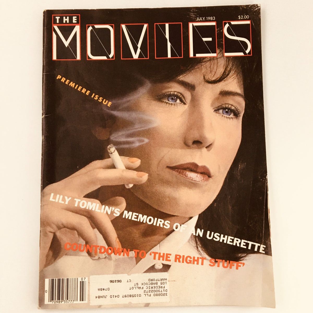 Vintage magazine cover of The Movies from July 1983 featuring Lily Tomlin's memoirs on usherettes, showcasing a glamorous portrayal of Hollywood's past.