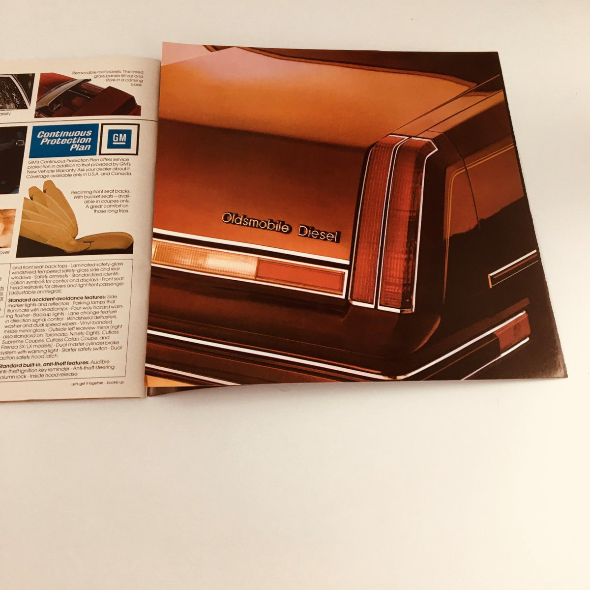 1983 Oldsmobile Cutlass Ciera, Supreme & Cruiser Feature Car Brochure Catalog showcasing the rear end of an Oldsmobile Diesel vehicle, highlighting its sleek design and branding.