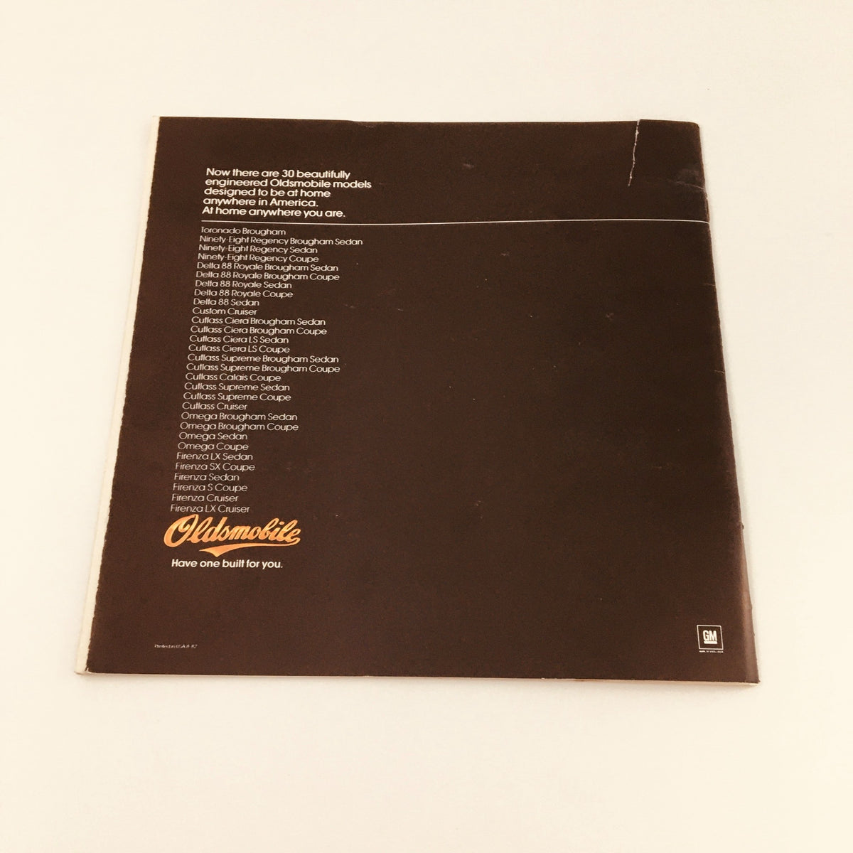 1983 Oldsmobile Cutlass Ciera, Supreme & Cruiser Feature Car Brochure Catalog featuring the back cover with a list of available Oldsmobile models from the era, presented on a clean, dark background.