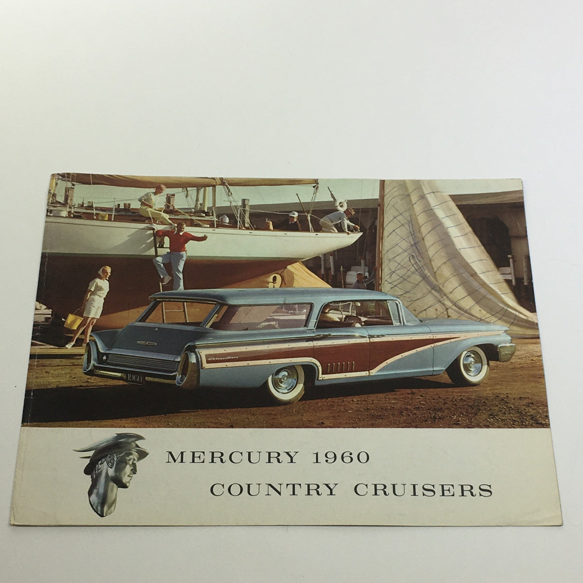 1960 Mercury Country Cruisers brochure featuring a vintage car parked beside a yacht, illustrating the elegance of the automotive design and lifestyle from the 1960s.