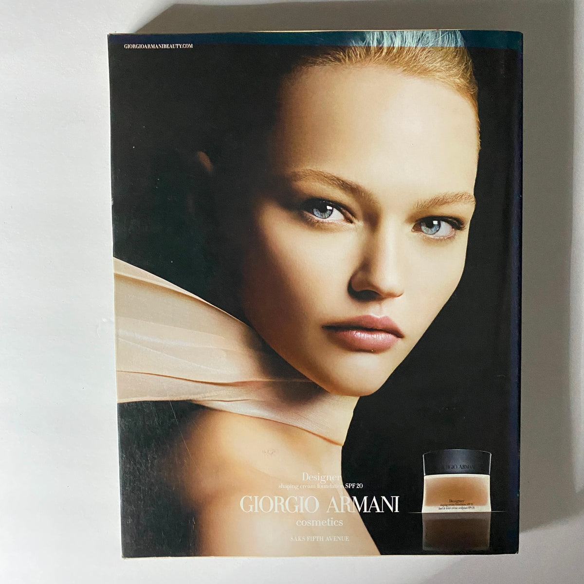 Close-up of a model's face showcasing Giorgio Armani cosmetics, featured in W Magazine September 2006 issue with actress Christina Ricci on the cover.