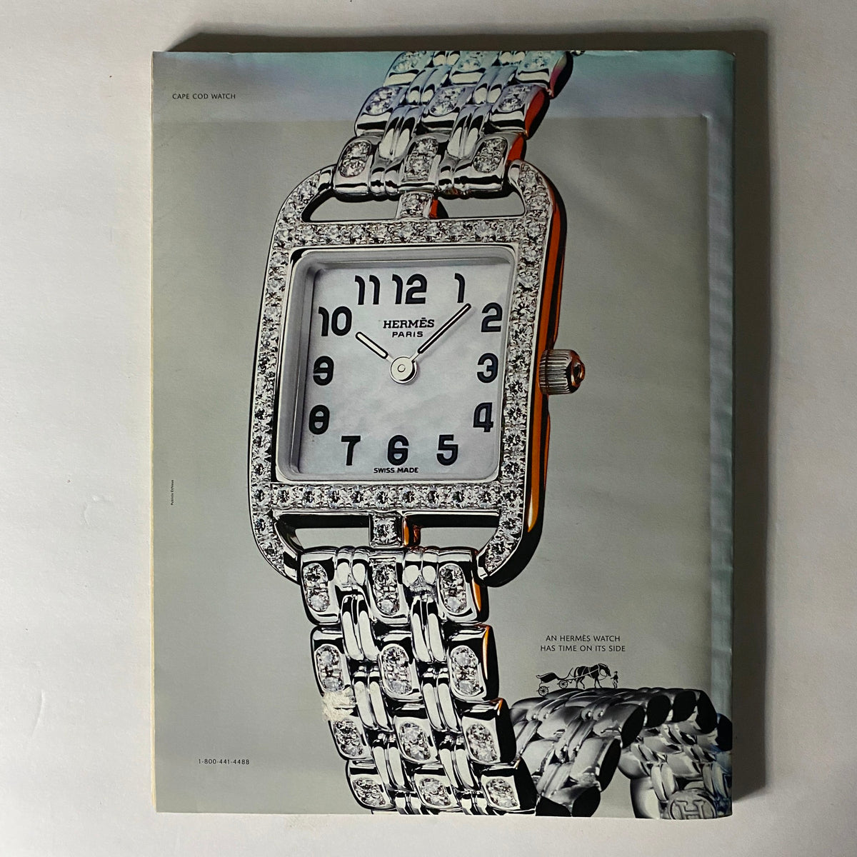 W Magazine May 2005 showcases an elegant Hermès watch with a sparkling diamond-encrusted design, emphasizing luxury and fashion that captures the essence of 2005.