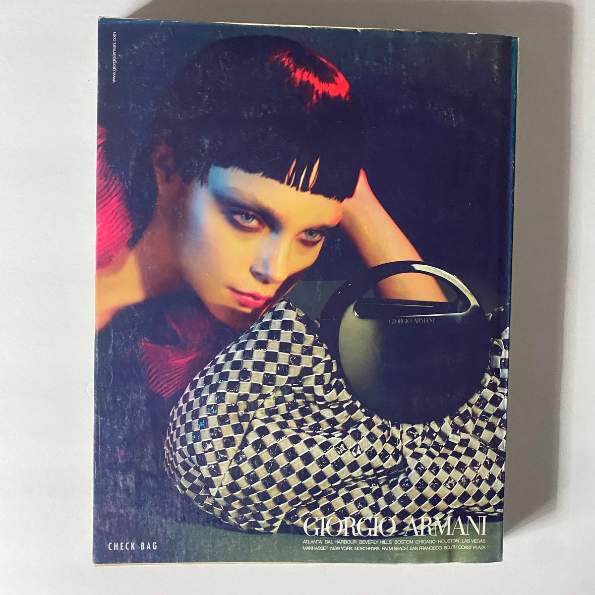 Giorgio Armani advertising spread from W Magazine September 2008, displaying a model in striking couture, reflecting key fashion trends of the era.