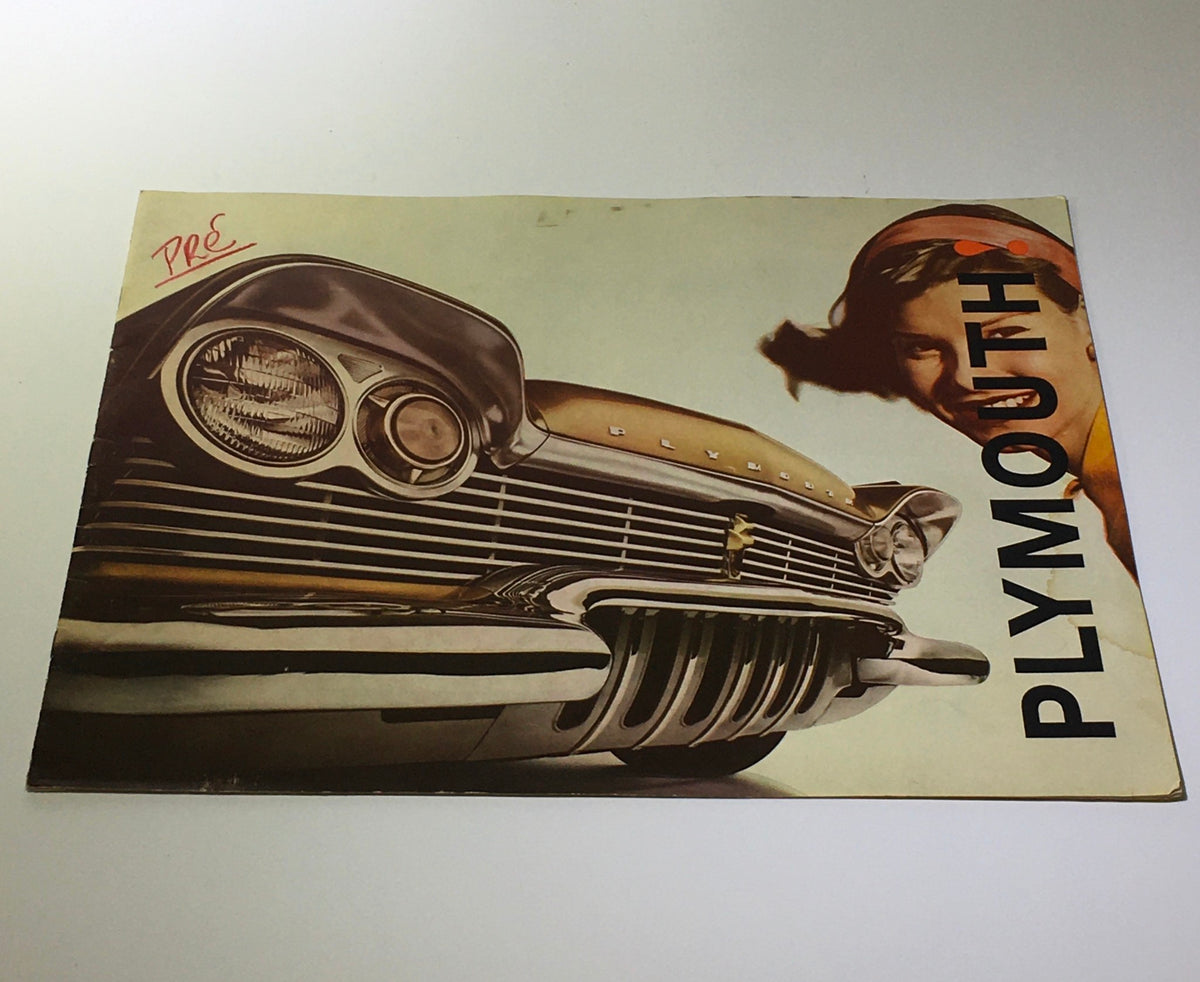 Vintage 1960 Plymouth Torsion-Aire Ride V-8 Engines V-6 Sport Suburban Catalog Brochure front cover featuring a classic car and a woman, highlighting the elegant design and branded logo.