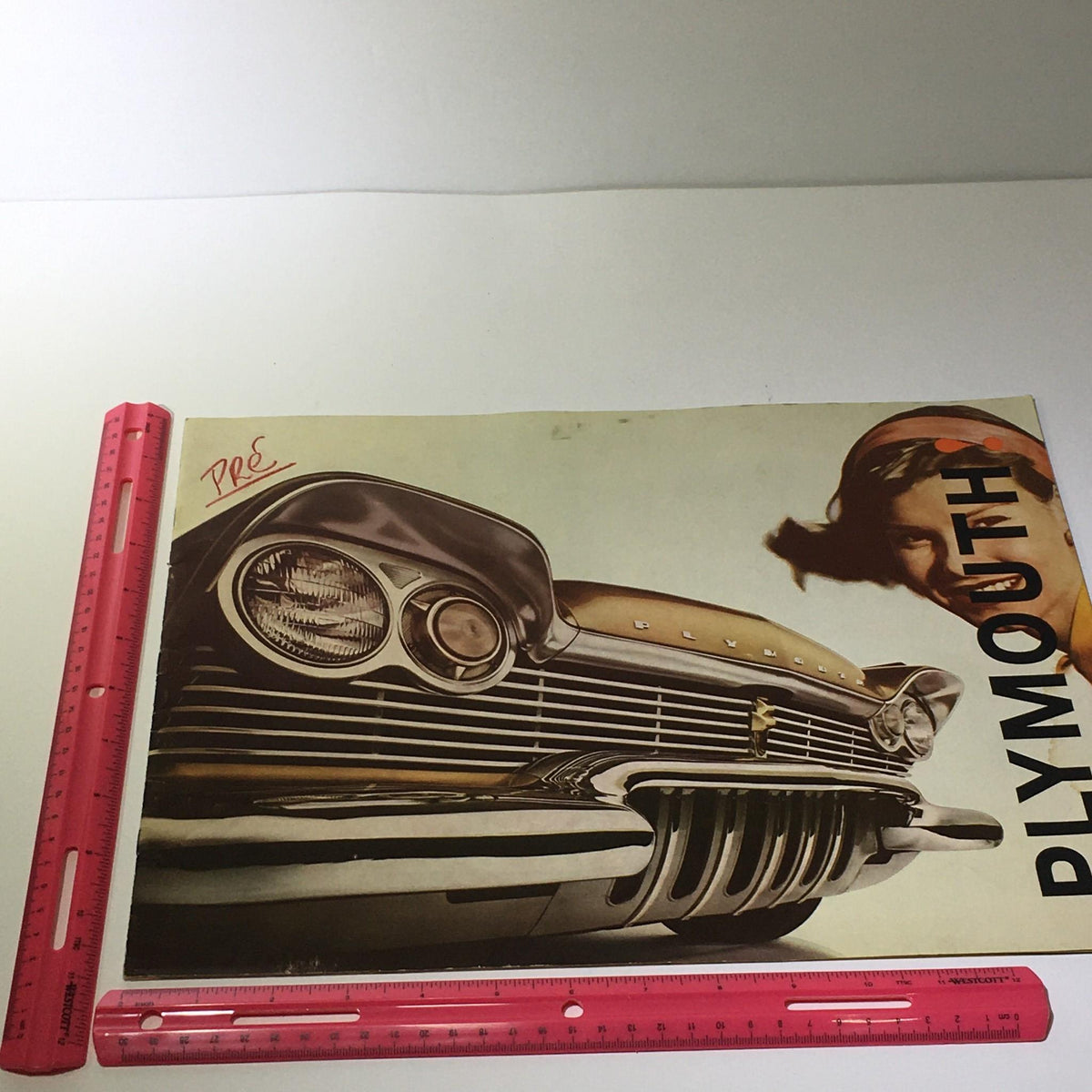 Cover image of the 1960 Plymouth Torsion-Aire Ride brochure with a vintage car and female model, measuring 14.5" x 11".