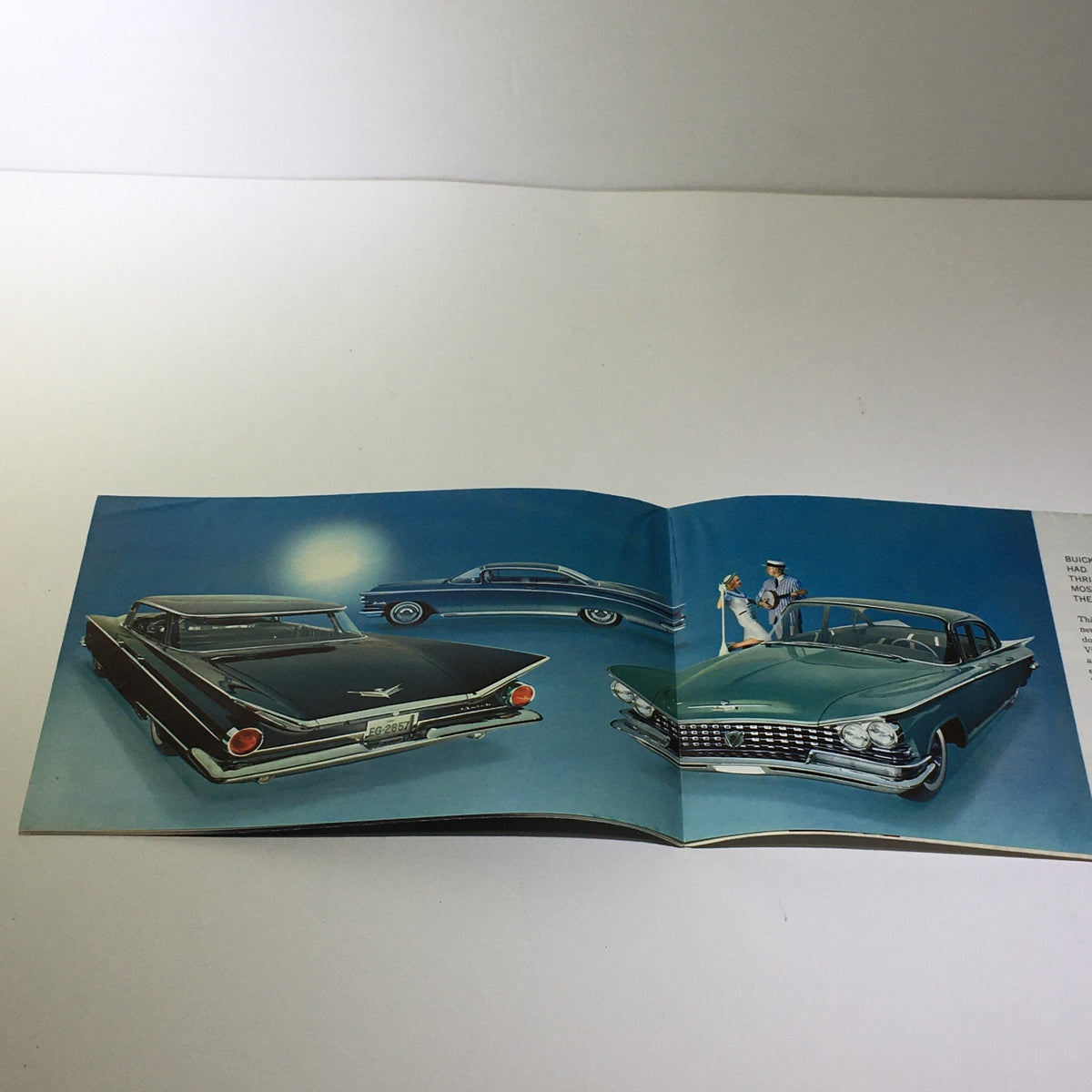 1959 Buick LeSabre Standard Twin Turbine Transmission 24-P Car Catalog Brochure showcasing multiple classic Buick cars in a stylish layout with a blue background, highlighting their elegant designs.