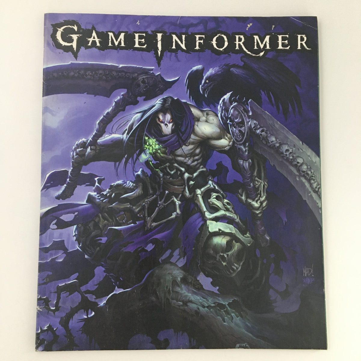 Cover of Game Informer Magazine July 2011 Issue 219 featuring Darksiders II video game guide, showcasing striking artwork of a character with long hair and a skeletal background.