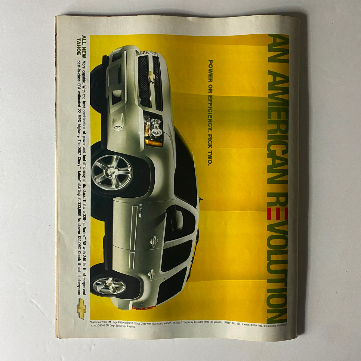 Image of an advertisement featuring a Chevrolet vehicle from the Sports Illustrated April 17, 2006 issue that has Phil Mickelson on the cover, highlighting the theme 'An American Revolution' with a focus on power and efficiency.