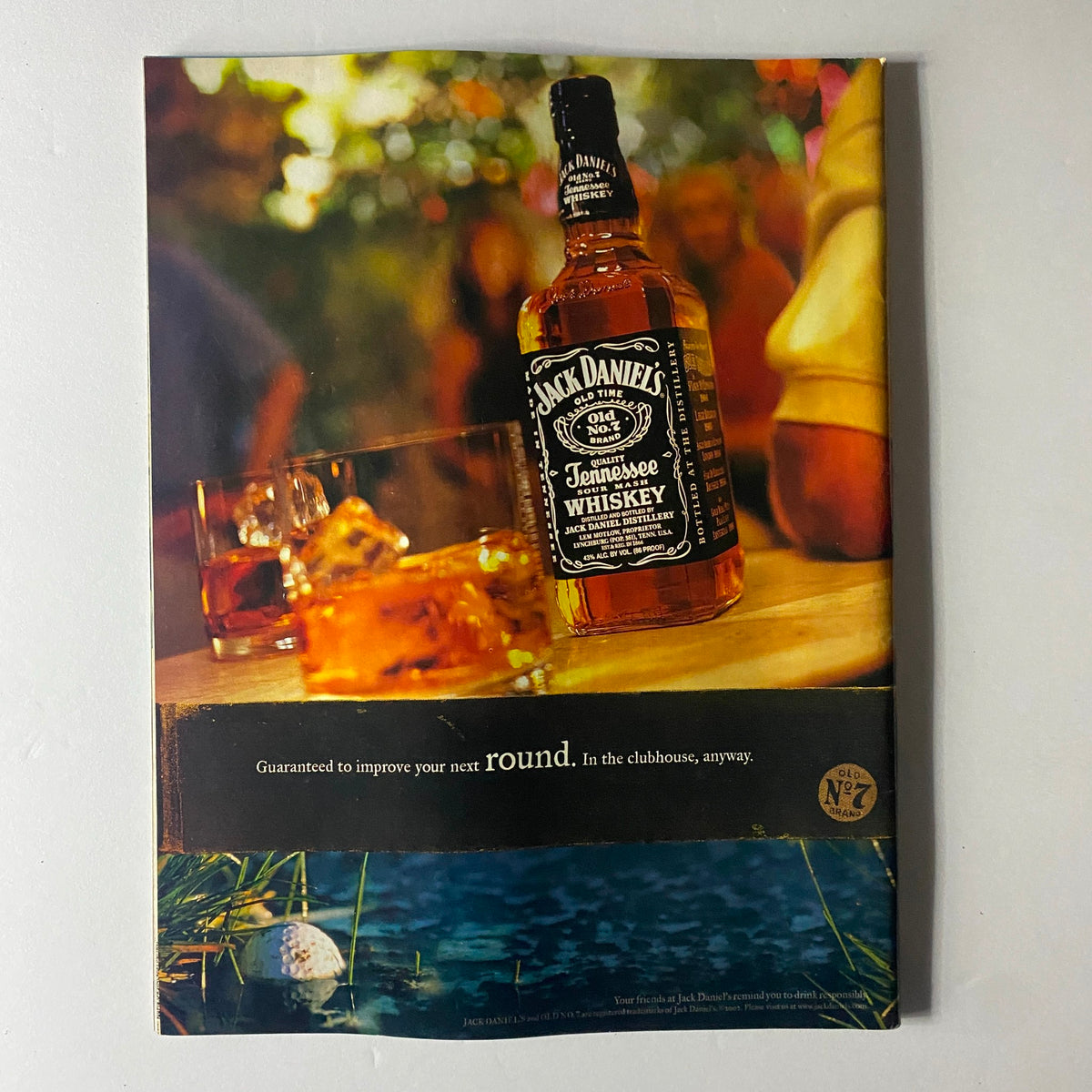 Cover of Sports Illustrated September 23, 2002 featuring a tribute to Johnny Unitas, showcasing a bottle of Jack Daniel's Tennessee Whiskey with glasses on a table, and a golf ball near water, emphasizing the magazine's vintage sports memorabilia appeal.