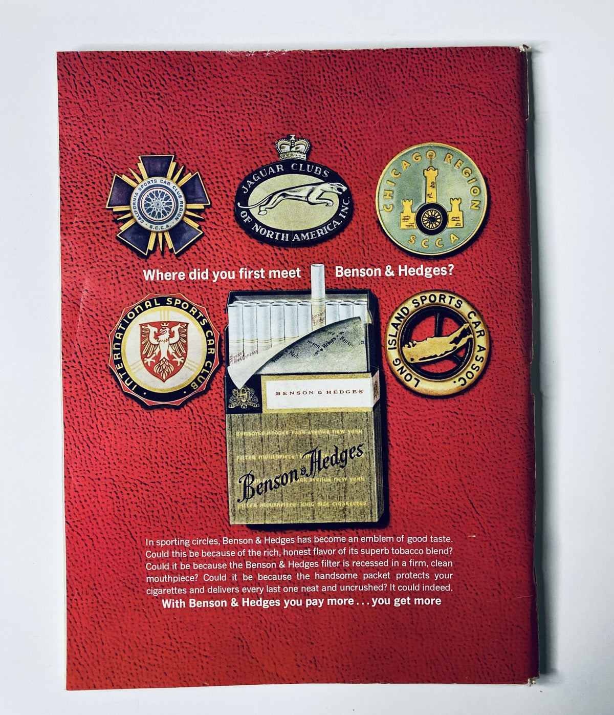 Back cover of The New Yorker Magazine April 18, 1964 featuring Benson & Hedges advertisement showcasing various club badges. Text references the company’s reputation within the tobacco industry.