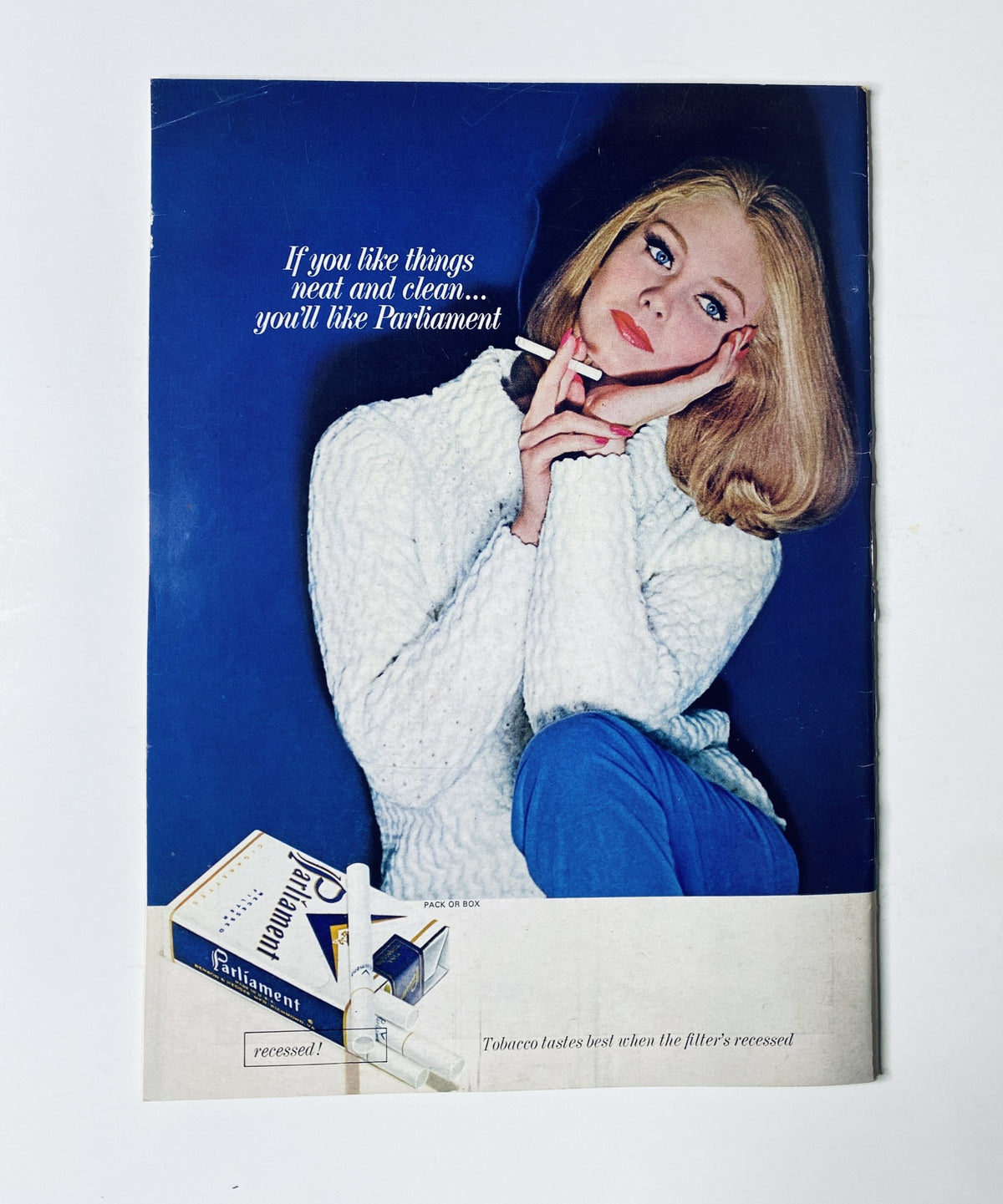 Advertisement from The New Yorker Magazine December 26, 1964 for Parliament cigarettes, featuring a model with a cigarette in hand promoting the product.