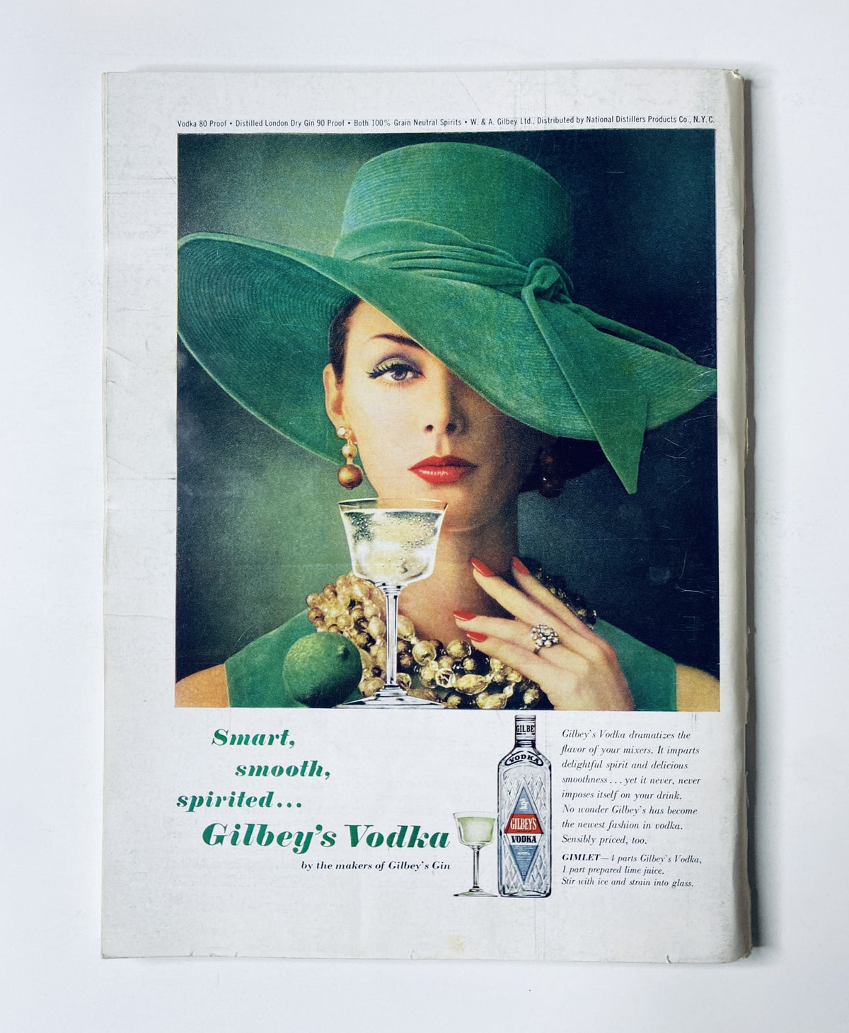 Cover of The New Yorker Magazine November 14, 1964 featuring an advertisement for Gilbey's Vodka with a glamorous woman in a green hat, emphasizing 'Smart, smooth, spirited... Gilbey's Vodka'.