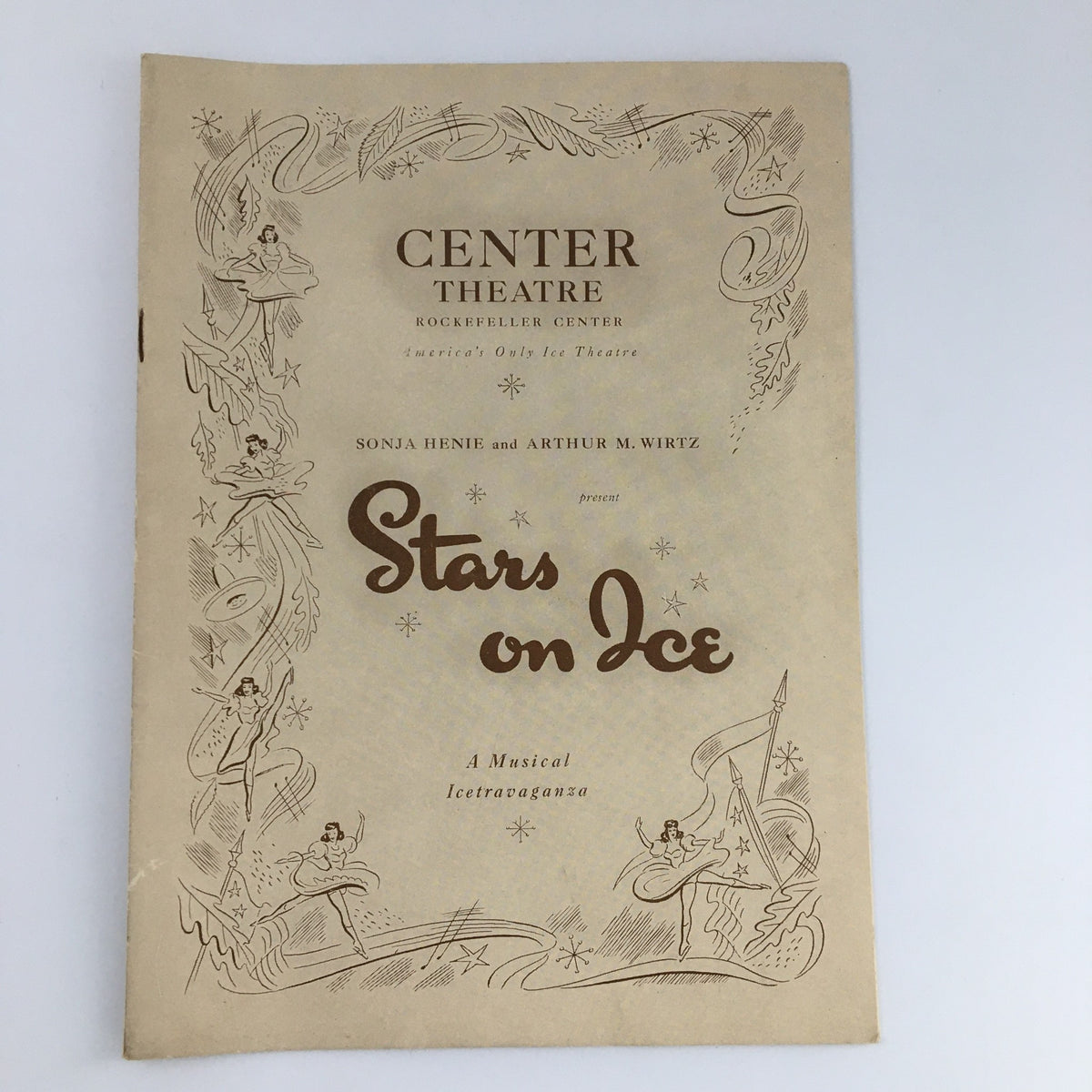 1943 Center Theatre Rockefeller Center 'Stars on Ice' program cover featuring Sonja Henie and Arthur Wirtz, highlighting the iconic ice skating show.