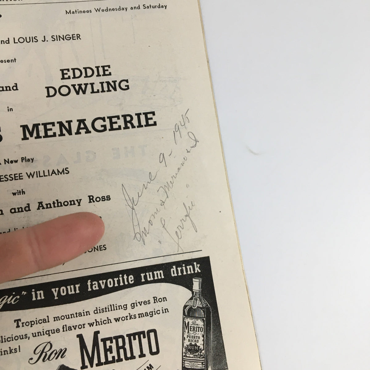 Close-up of a signed date in the 1945 Playbill for 'The Glass Menagerie', highlighting memorabilia details.