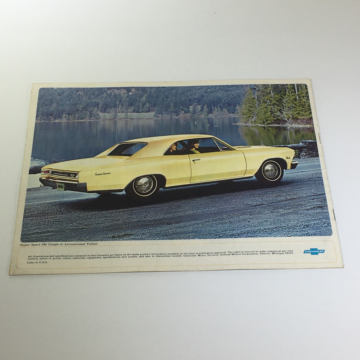 1966 Chevelle 300 Deluxe 2-4 Door Sedan/Super Sport 396 Coupe Chevrolet Catalog showcasing a yellow Super Sport 396 Coupe parked by a serene lake with trees in the background.