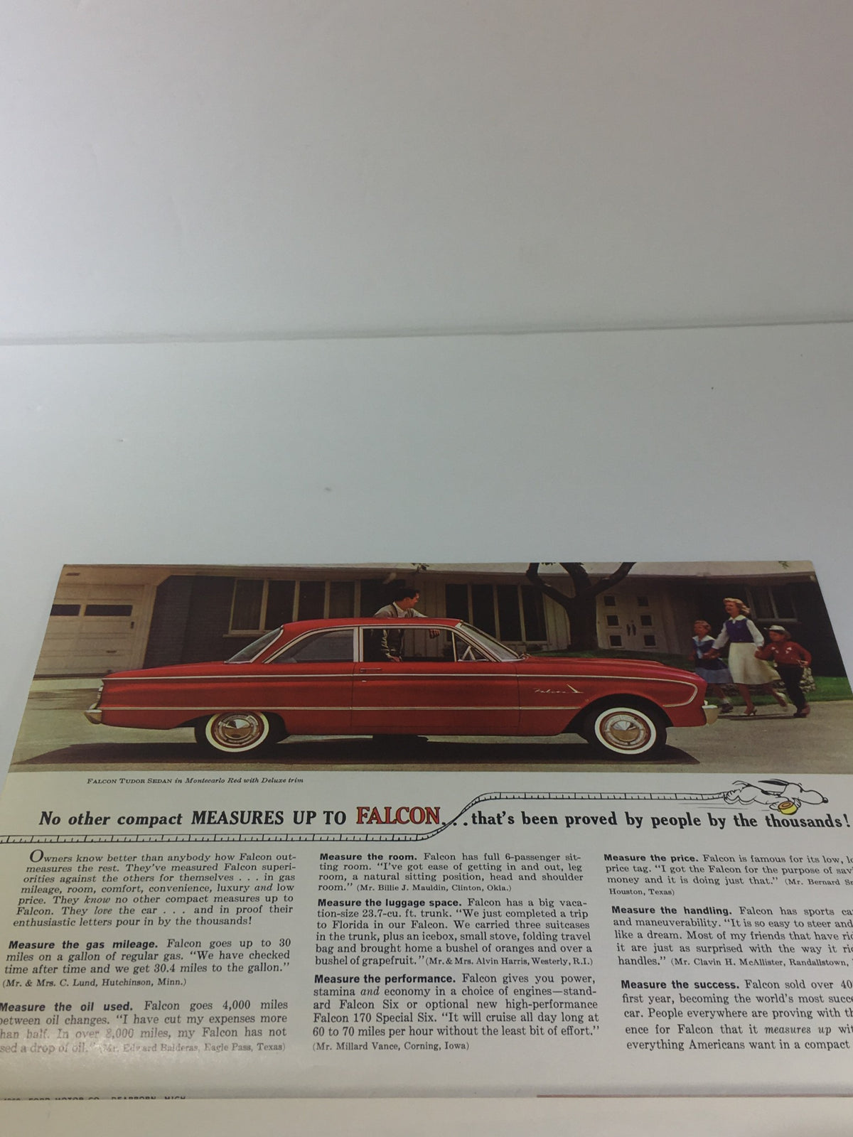 1961 Ford Falcon Fordomatic 2-Speed car catalog brochure showcasing a red Ford Falcon parked outside a building, emphasizing its compact design.