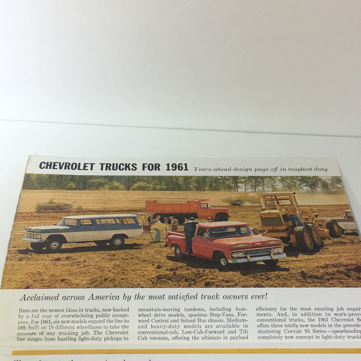Inside page of Chevrolet Trucks of 1961 Models & Specifications Light-Heavy Duty Trucks Catalog showcasing various Chevrolet trucks on a farm, demonstrating their capabilities.