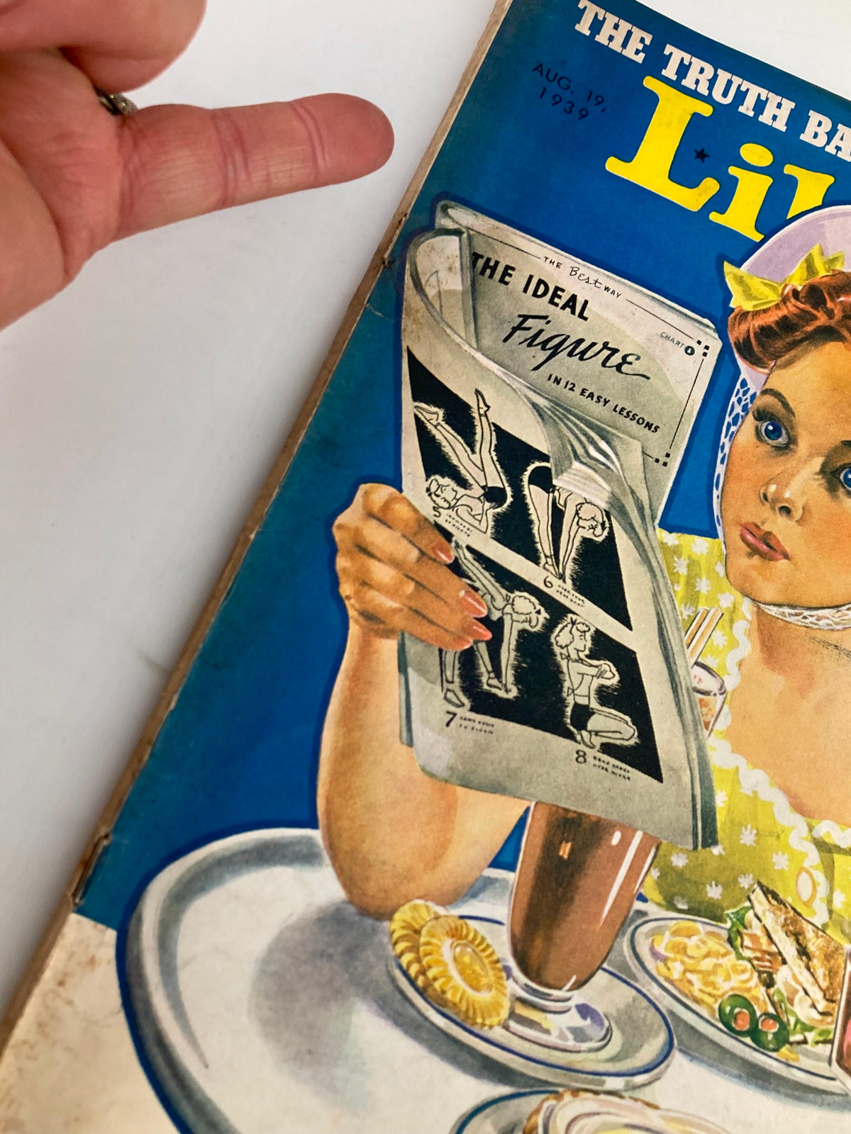 Close-up of the August 19, 1939, Liberty Magazine cover, highlighting a woman holding the magazine titled 'The Ideal Figure,' emphasizing vintage design and style.